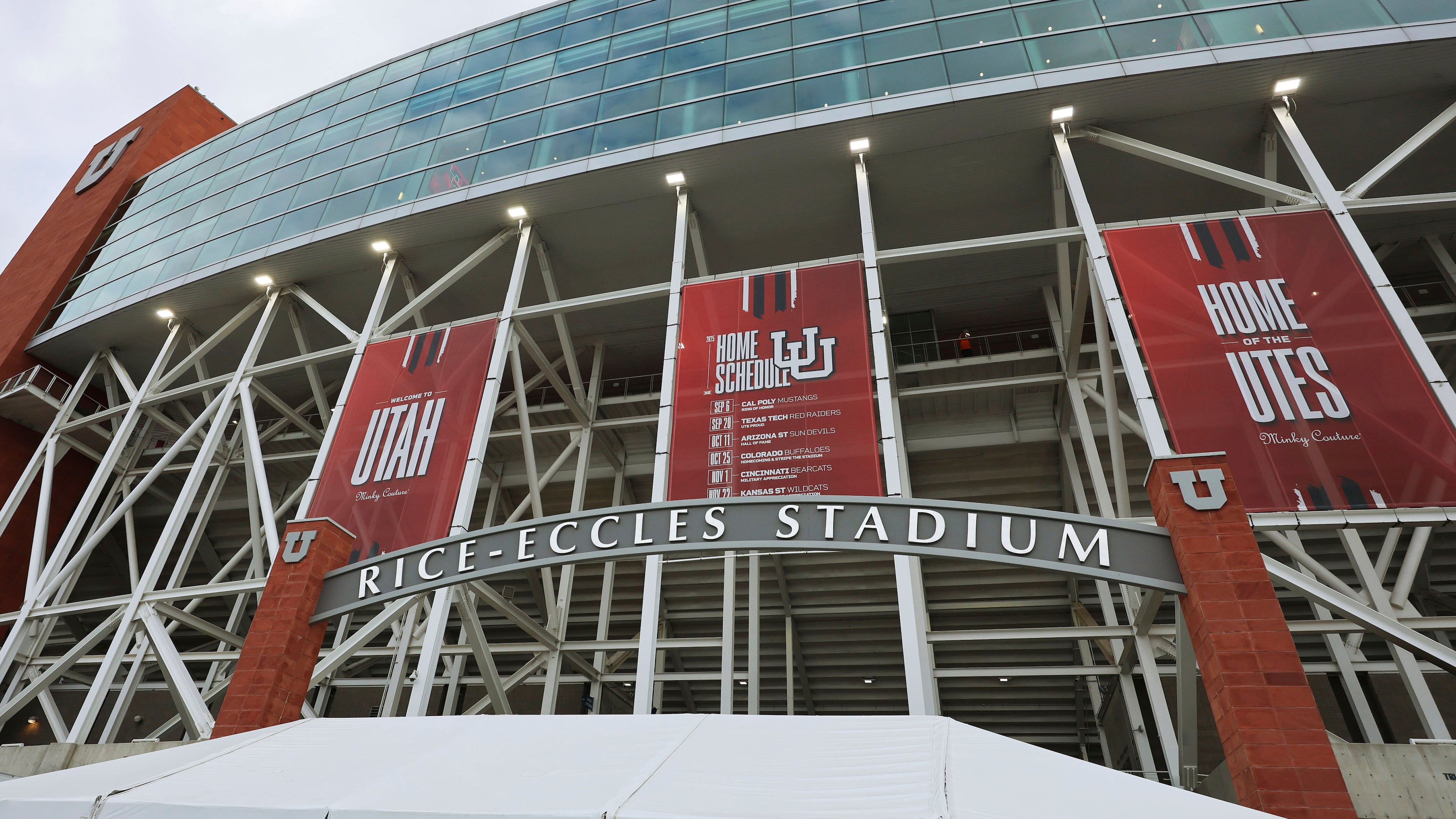 FILE - Banners hang outside Rice Eccles Stadium during an NCAA college football game Sept. 20, 2025, in Salt Lake City, Utah. (AP Photo/Jeffrey D. Allred, File)