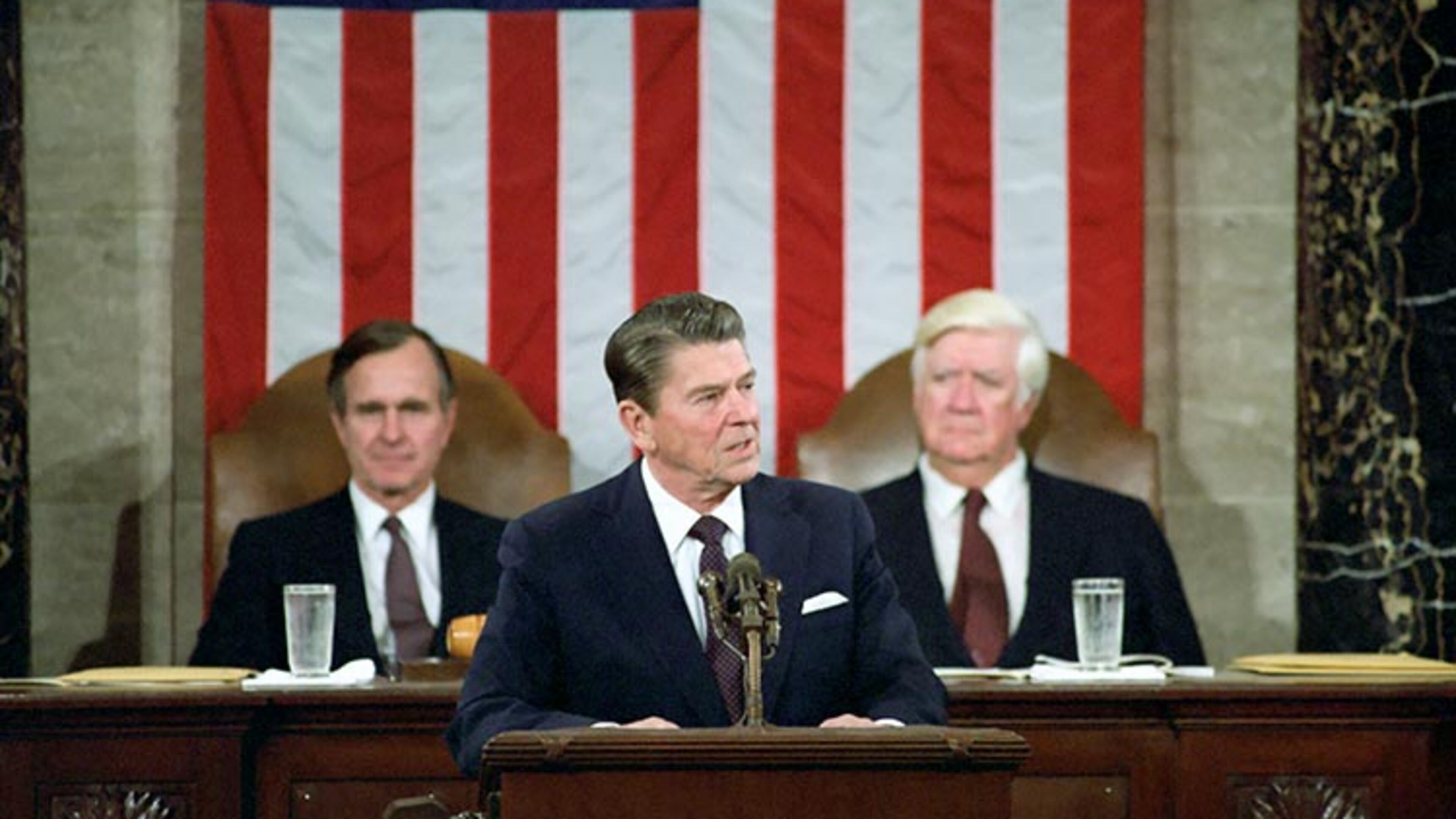 2/18/1981 President Reagan George Bush Thomas "Tip" O'Neill Addressing Joint Session of Congress on Program for economic recovery in House Chamber United States Capitol. Courtesy Ronald Reagan Library.