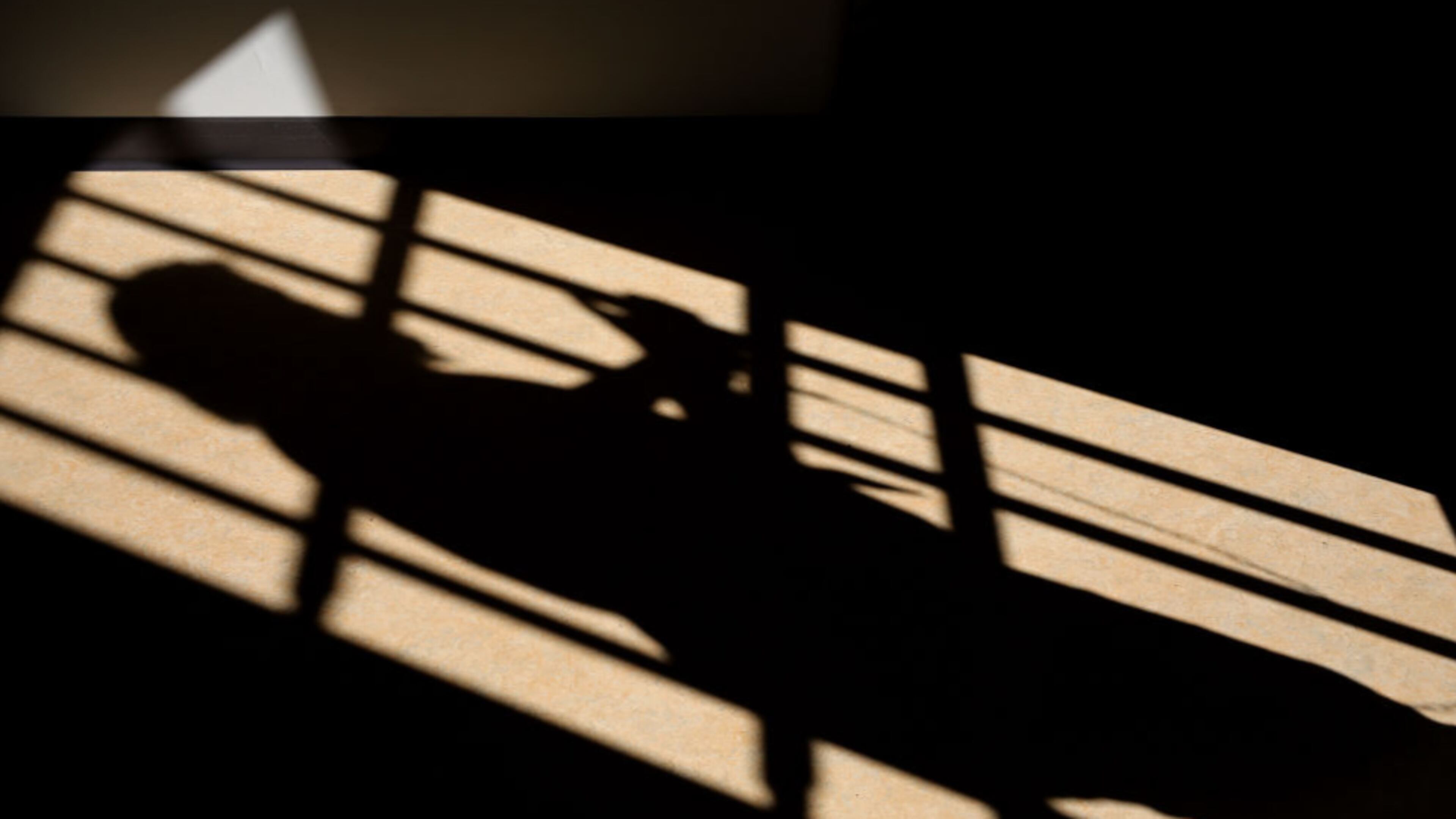 A shadow is cast of a prison cell door. (Photo: Dan Kitwood/Getty Images)