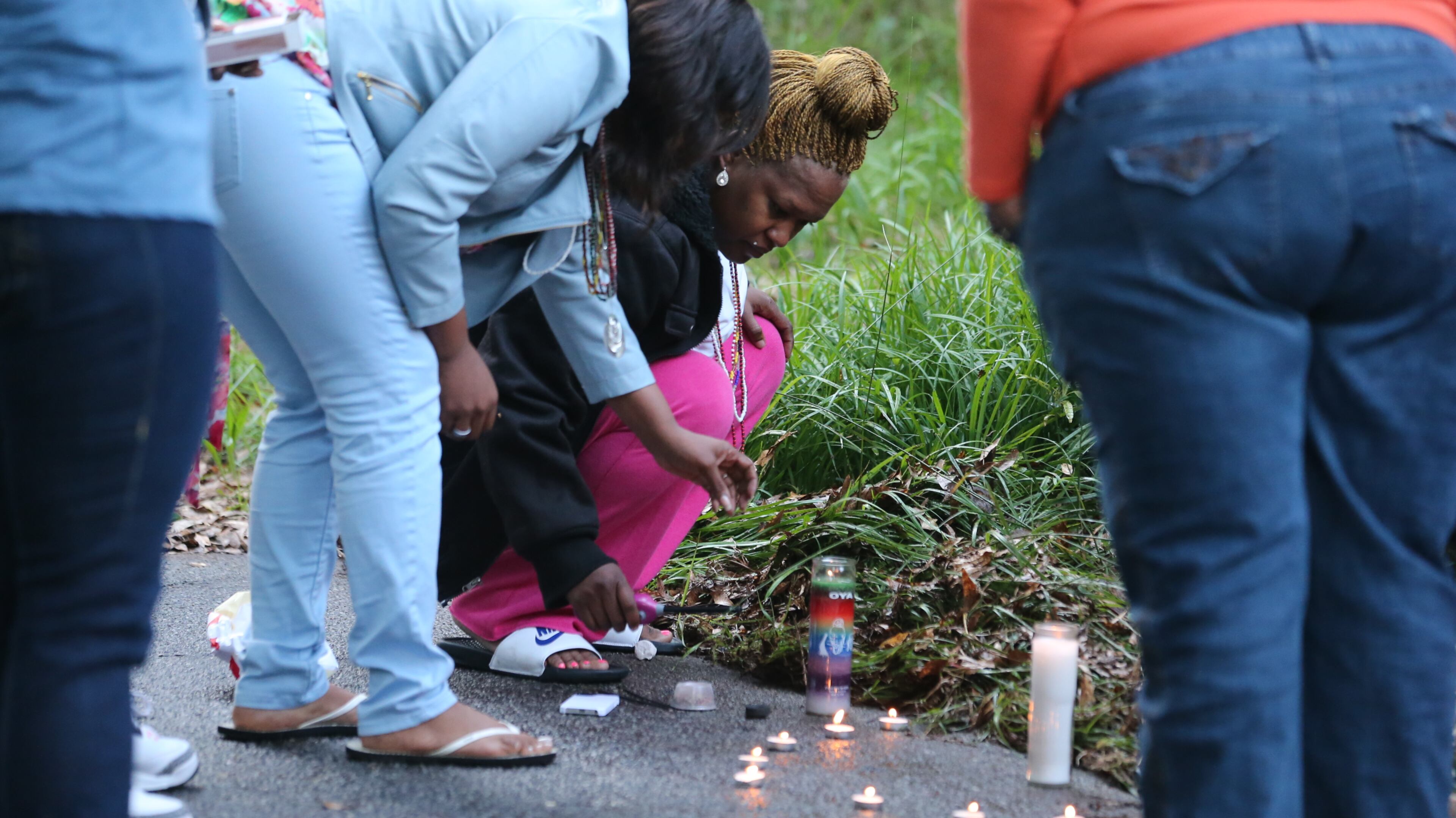 Atlanta police this morning were investigating a predawn shooting that left a man dead in the middle of a southwest Atlanta street. Family members grieve by a makeshift memorial. The shooting happened around 3:15 a.m. in the 1800 block of Orlando Street, according to Atlanta police Capt. Paul Guerrucci. JOHN SPINK/JSPINK@AJC.COM