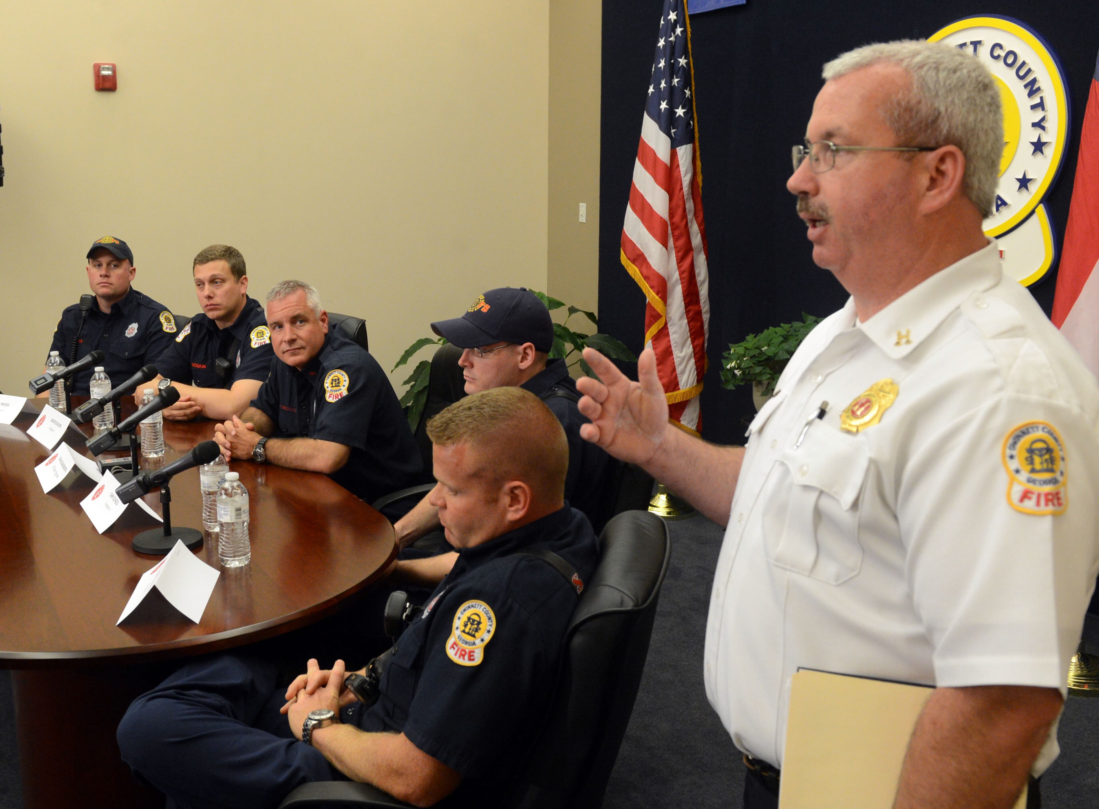 Gwinnett County Fire PIO Tommy Rutledge asks for questions during the news conference.