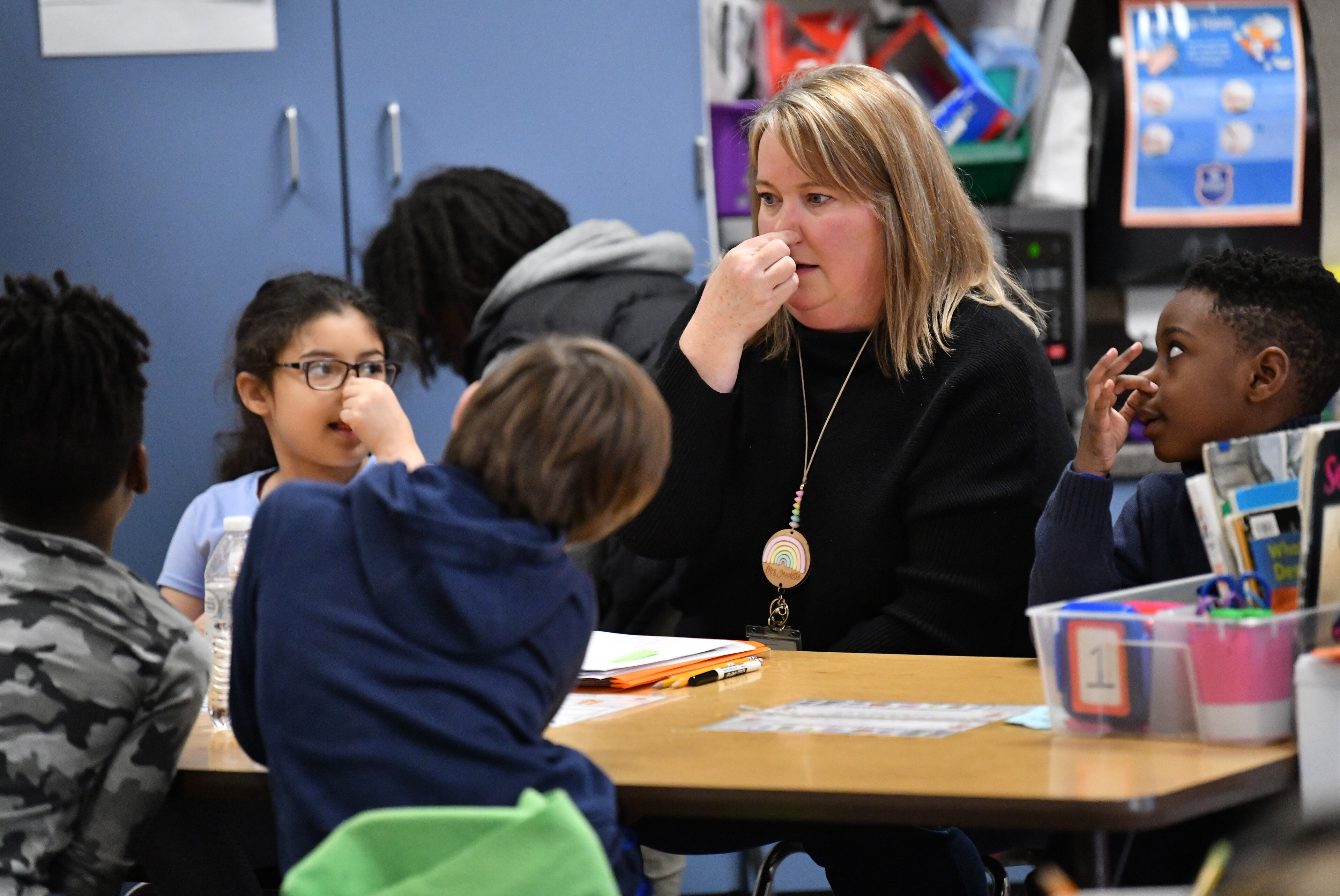 Teaching coach Katie Gaudette leads a small group during a literacy lesson in Jennifer Brems' first grade classroom at A.L. Burruss Elementary School, Friday, Feb. 3, 2023, in Marietta. (Hyosub Shin / Hyosub.Shin@ajc.com)