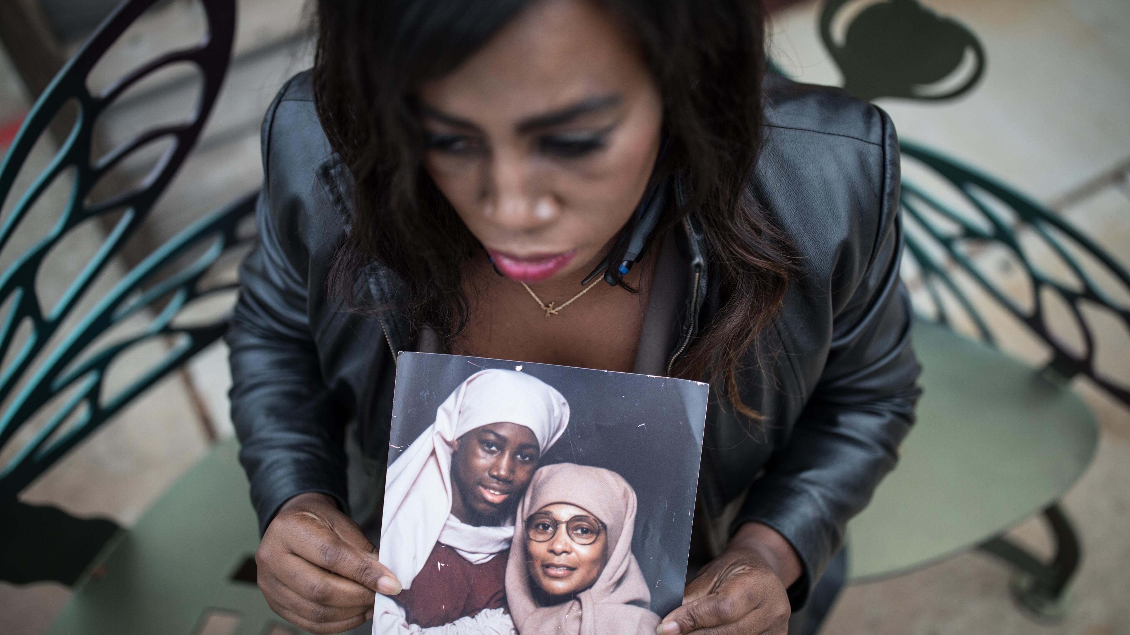Joy Fluker poses for a portrait holding a photo of her and her mother, Anna Elizabeth Young, who was arrested for killing a young boy in Florida, Thursday, Dec. 7, 2017, in Woodstock, Ga. BRANDEN CAMP/SPECIAL