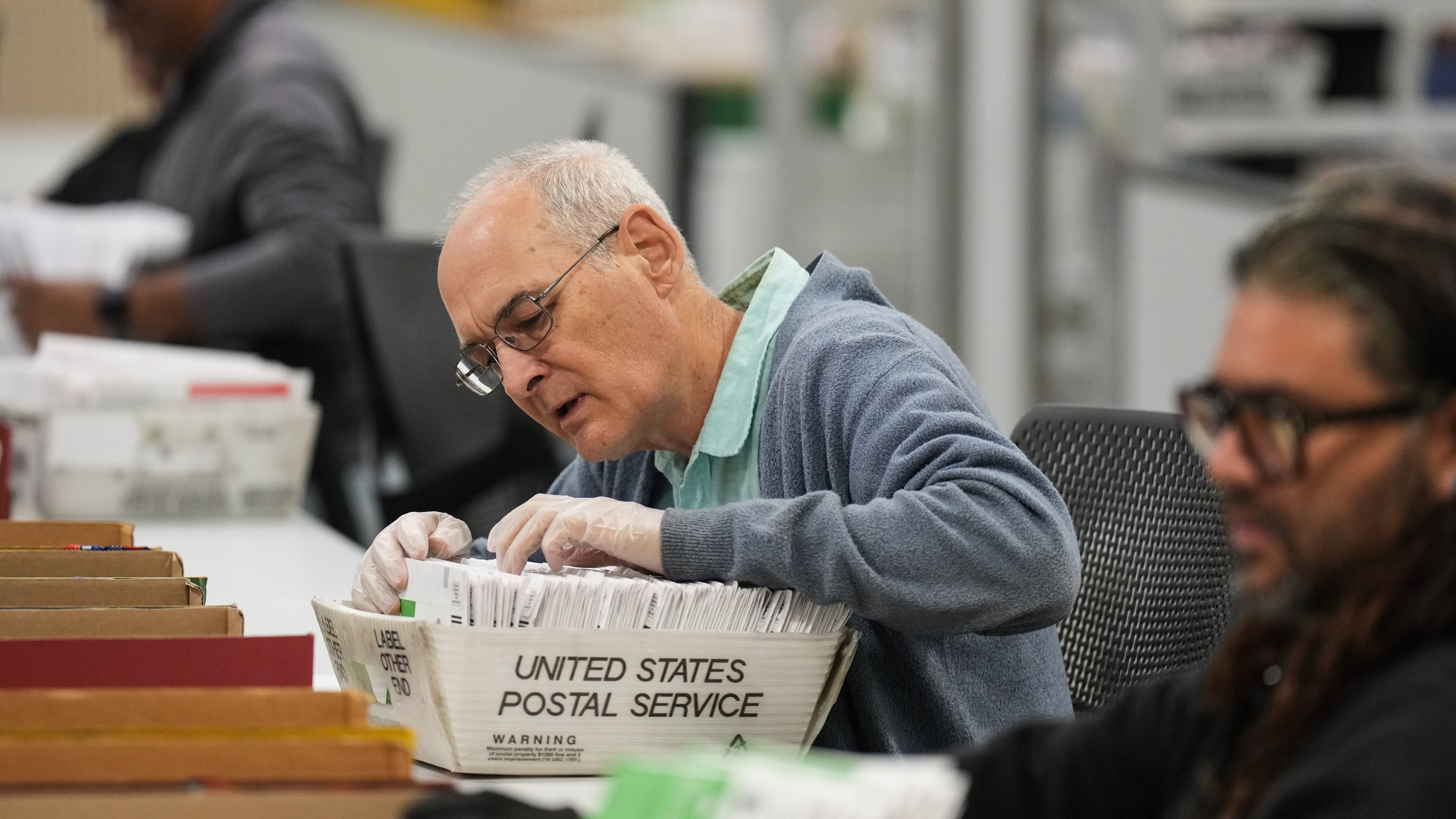 Workers sort ballots the day after California's primary election at the Los Angeles County Ballot Processing Center Wednesday, June 3, 2026, in City of Industry, Calif. (AP Photo/Jae C. Hong)