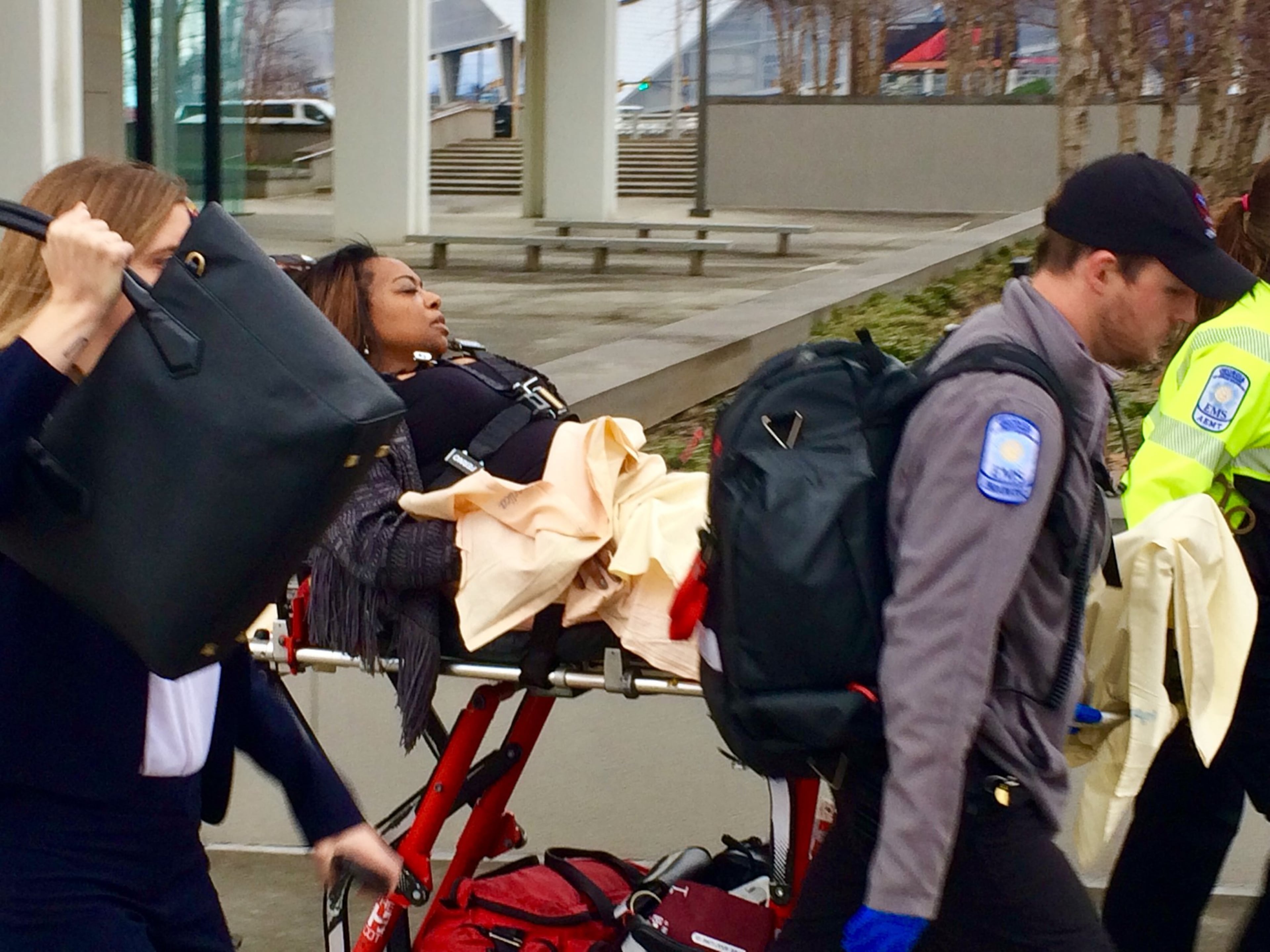 Katrina Taylor-Parks, the deputy chief of staff to former Atlanta Mayor Kasim Reed, is led out of the Richard B. Russell Federal Building by paramedics after she collapsed during her sentencing in the federal probe of corruption at Atlanta City Hall.