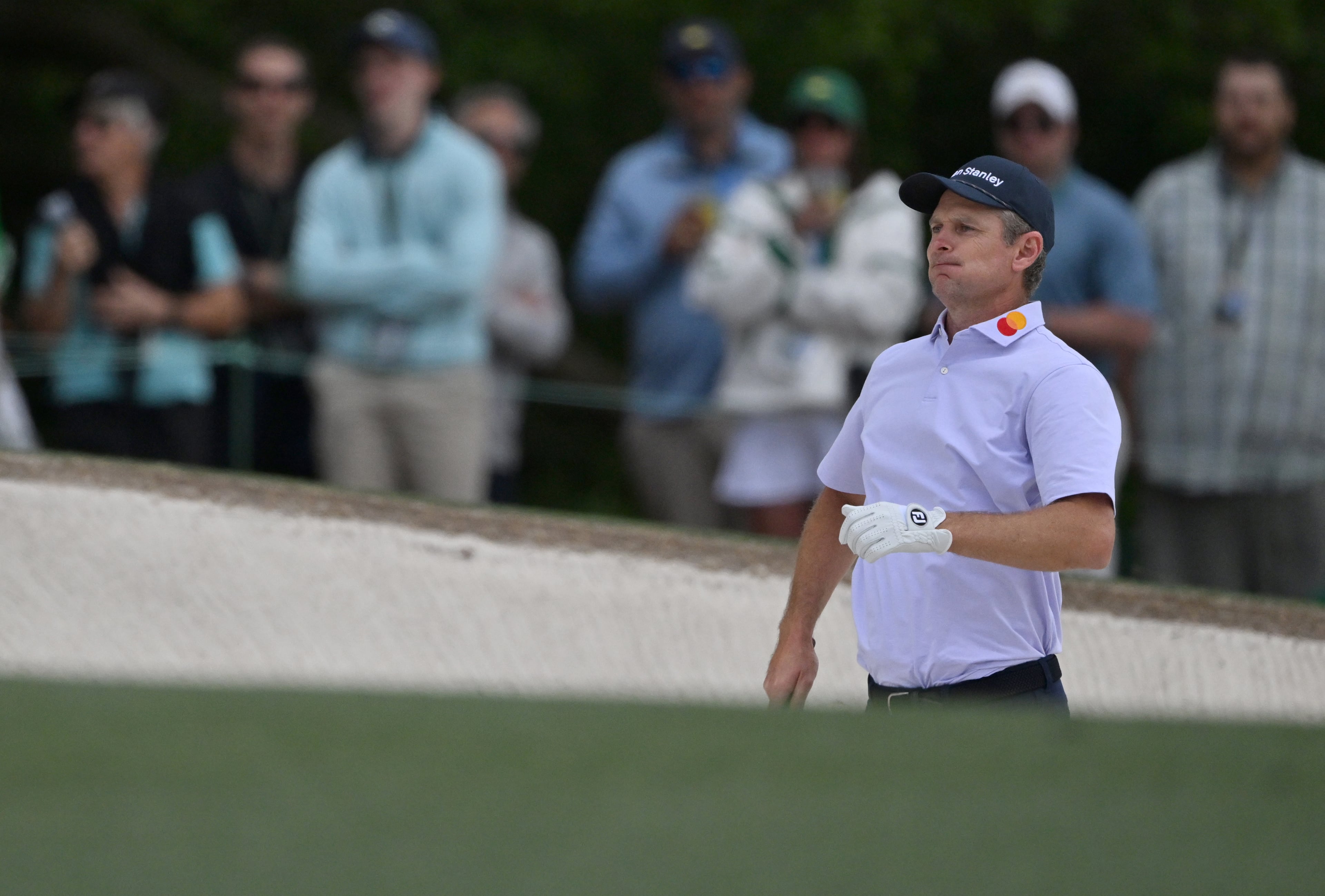 Justin Rose prepare for a bunker shot on first hole during third round of the Masters golf tournament, at Augusta National Golf Club, Saturday, April 12, 2025, in Augusta, Ga. (Hyosub Shin / AJC)