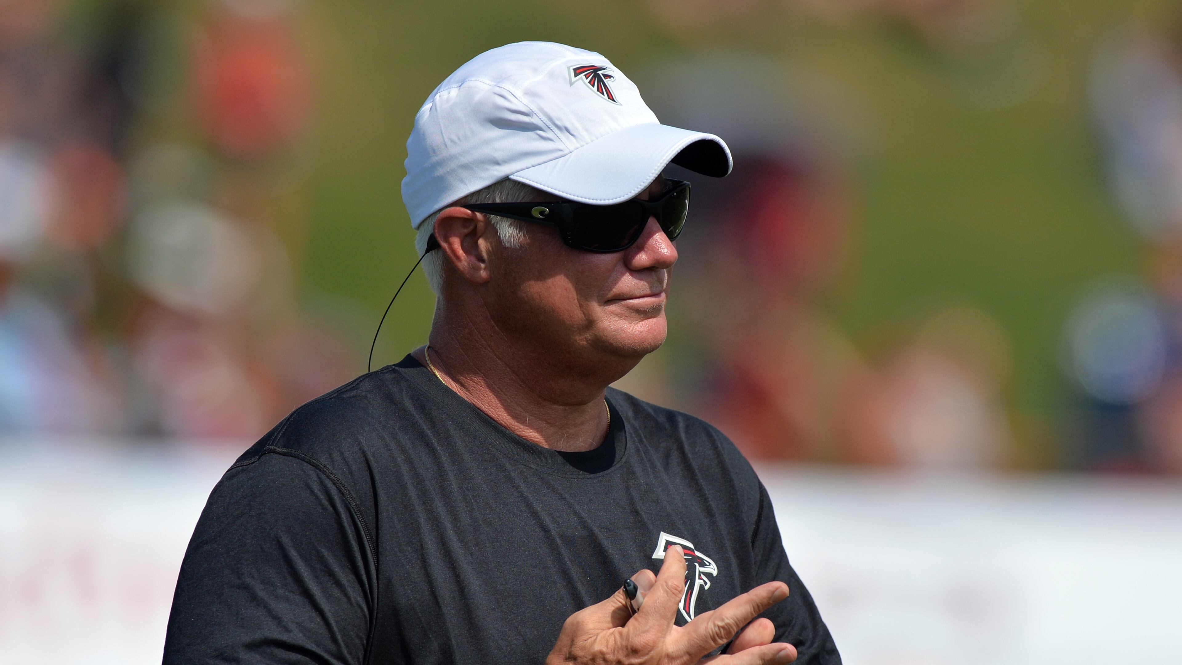 Atlanta Falcons head coach Mike Smith observes practice during training camp on Friday, July 25, 2014.