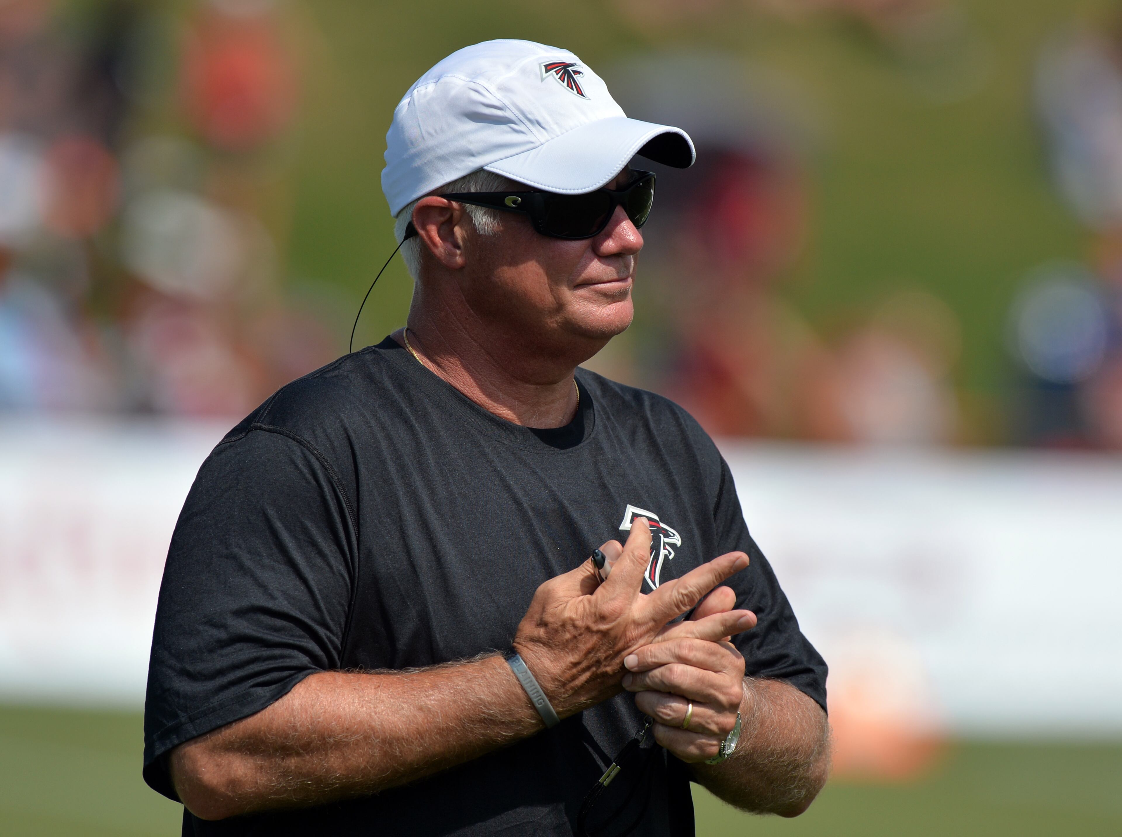 Atlanta Falcons head coach Mike Smith observes practice during training camp on Friday, July 25, 2014.