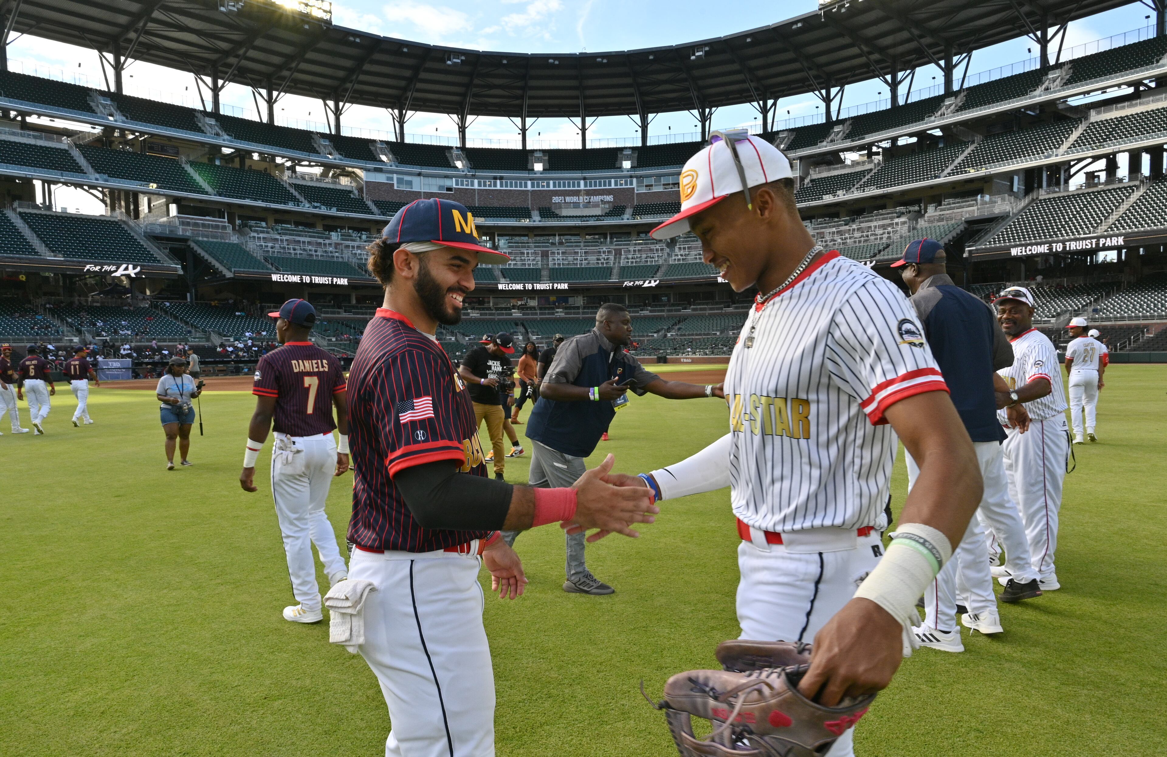 HBCU All-Star Navy team's Isaiah Montes (left) and White team's outfielder Michael Archie II shake hands before the Minority Baseball Prospects HBCU All-Star Game at Truist Park on Friday, June 3, 2022. (Hyosub Shin / Hyosub.Shin@ajc.com)