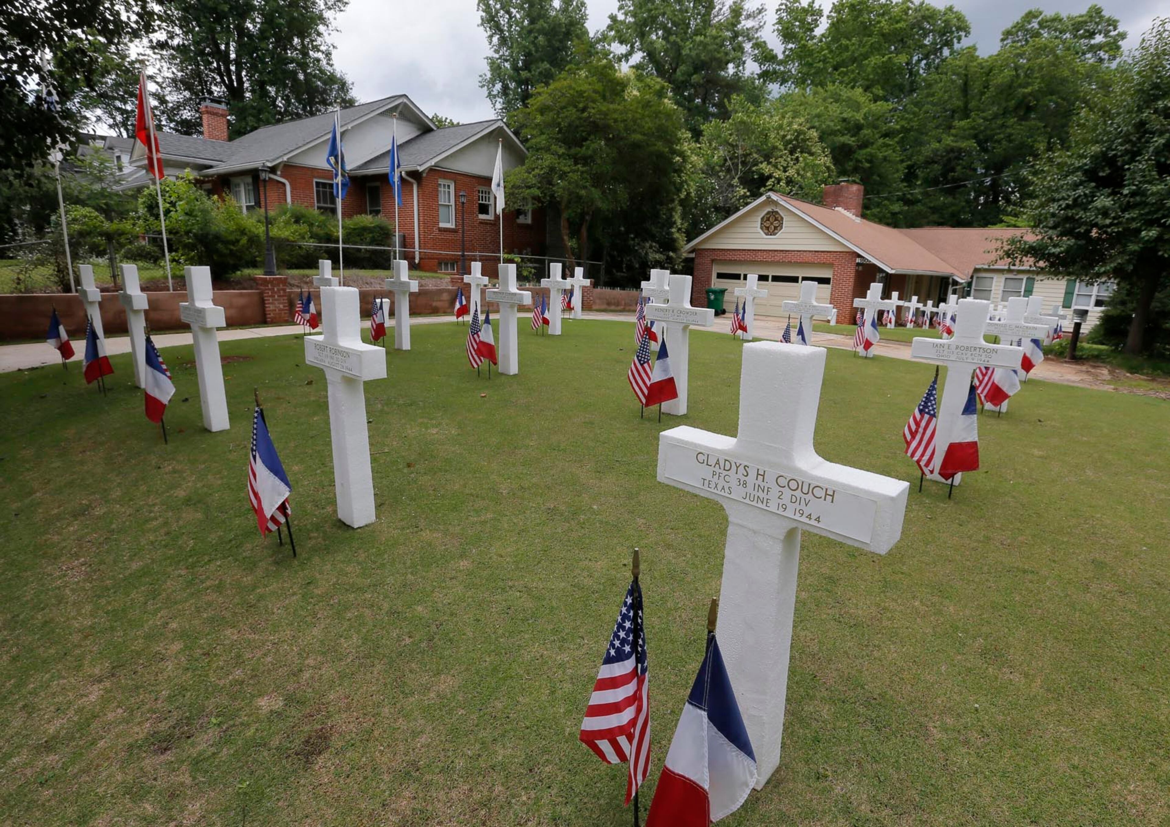 6/5/17 - Atlanta, GA - A homeowner in Atlanta has created a Normandy memorial to honor lost soldiers. He displays it in his yard from Memorial Day through D Day every year. The Druid Hills area display on Ridgewood Drive includes an information kiosk with informational pamphlets. According to the website at http://www.dday0606.org, the the first exhibition of the memorial was on June 6th, 2004. BOB ANDRES /BANDRES@AJC.COM