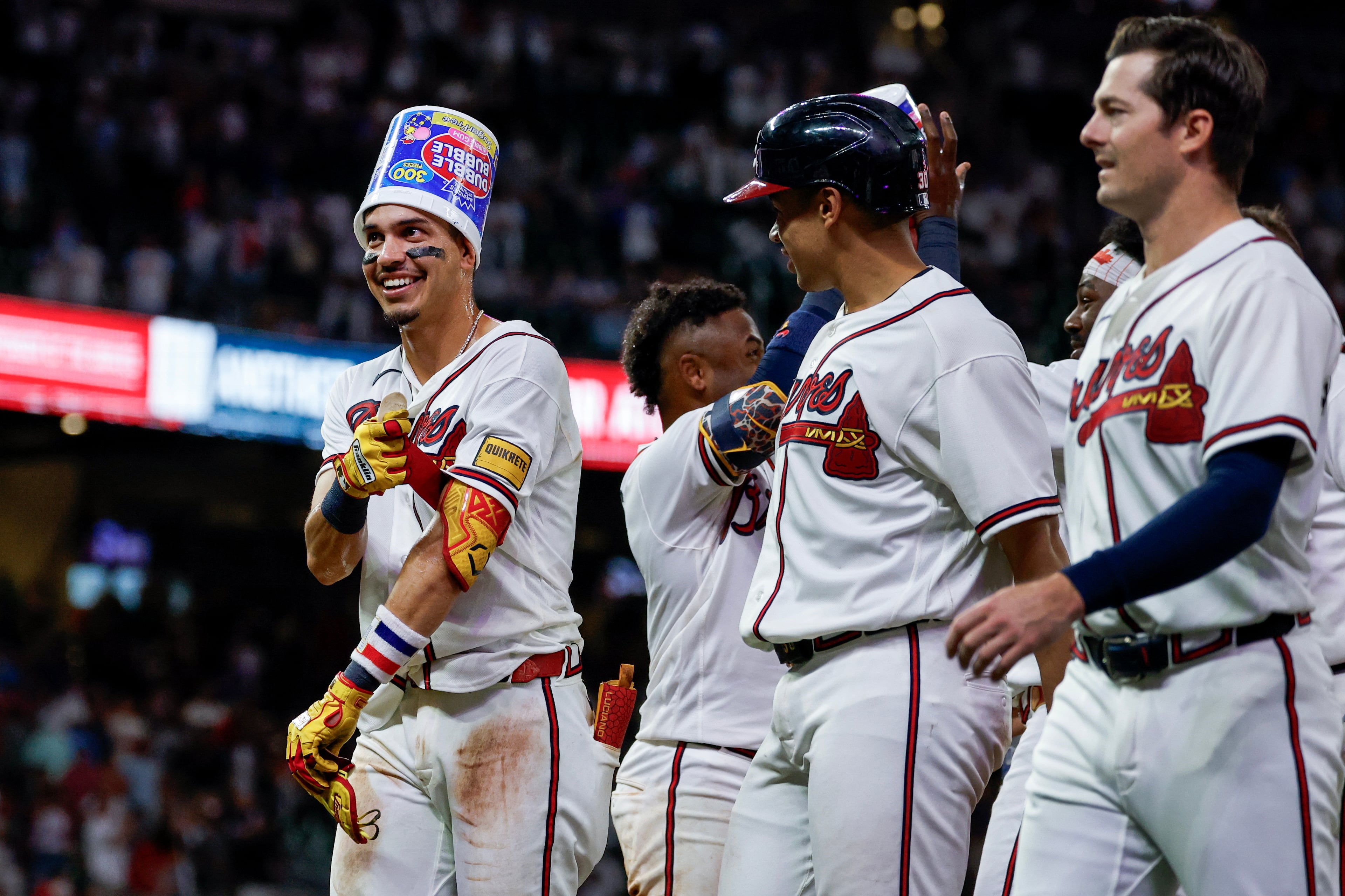 Mauricio Dubón, happily hatted after his extra-inning walk-off hit on Wednesday. (Erik S. Lesser/AP)
