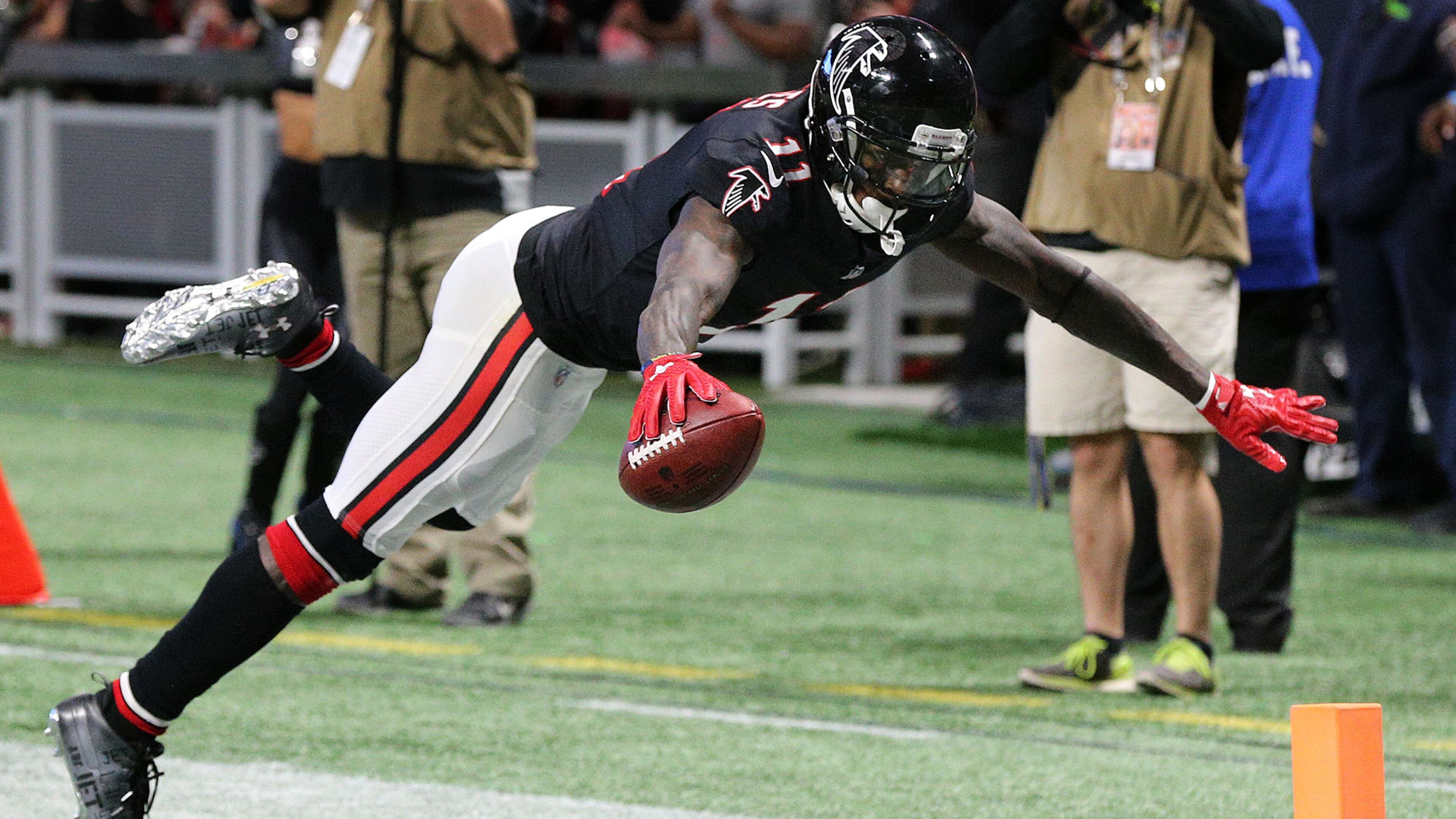 Falcons wide receiver Julio Jones reaches to score his second touchdown on the day soaring into the end zone during the second quarter against the Buccaneers in a NFL football game on Sunday, November 26, 2017, in Atlanta. Curtis Compton/ccompton@ajc.com
