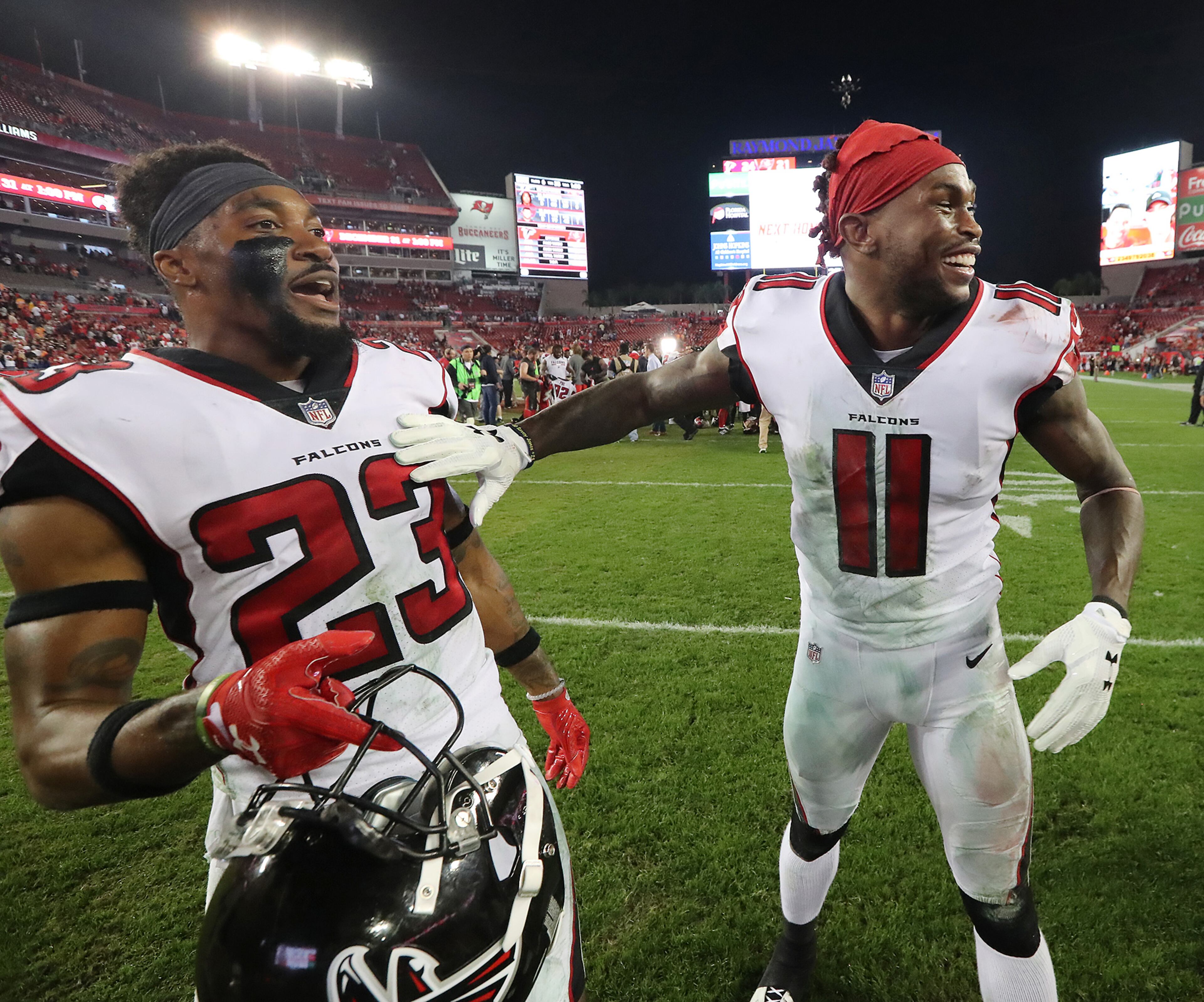 December 18, 2017 Tampa: Falcons cornerback Robert Alford and wide receiver Julio Jones celebrate a 24-21 victory over the Buccaneers to remain in the hunt for the NFC South division during a NFL football game on Monday, December 18, 2017, in Tampa. Curtis Compton/ccompton@ajc.com