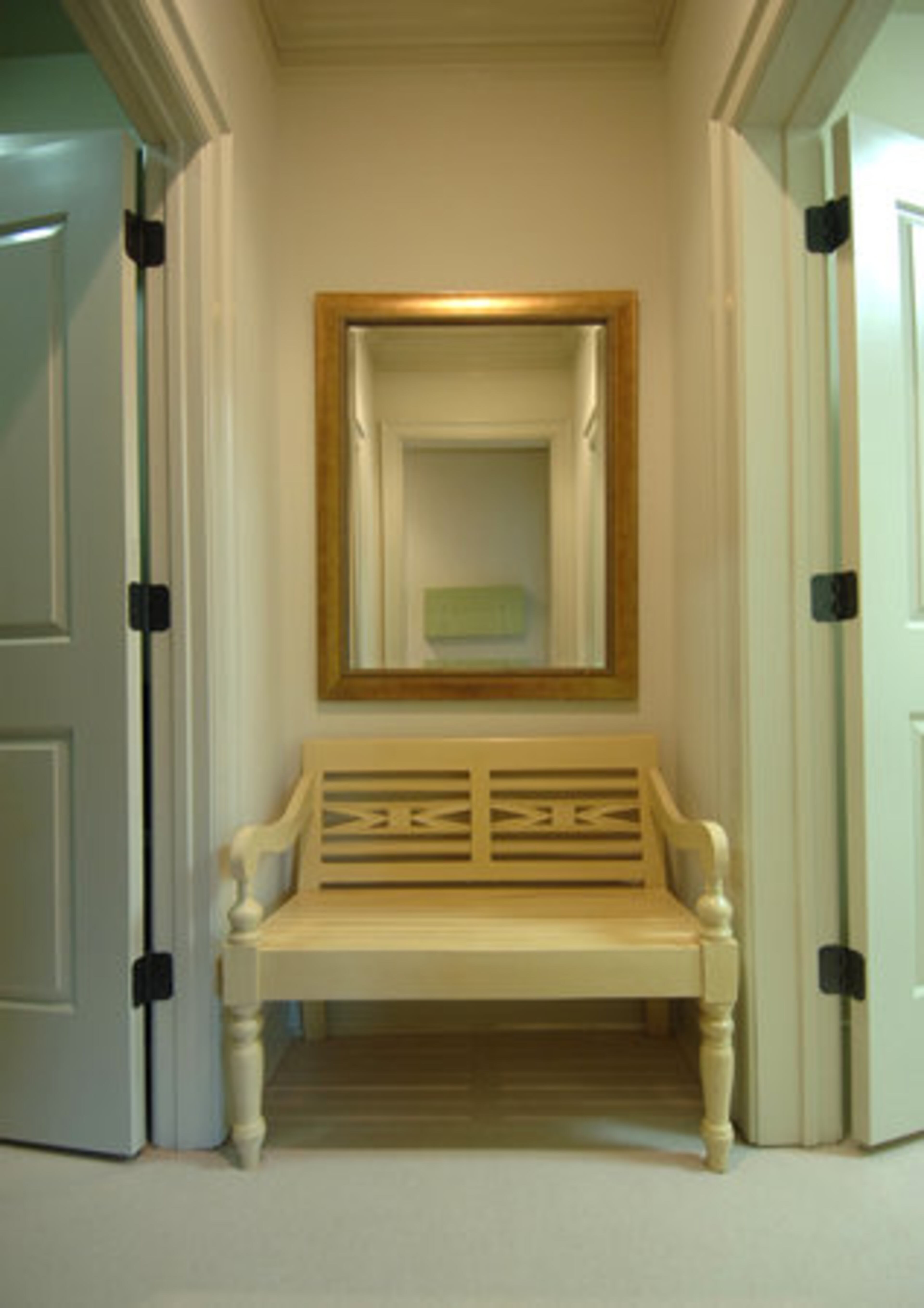 This cheery bench resides between two roomy walk-in closets. Kansas said it makes a handy stop for putting on his shoes.