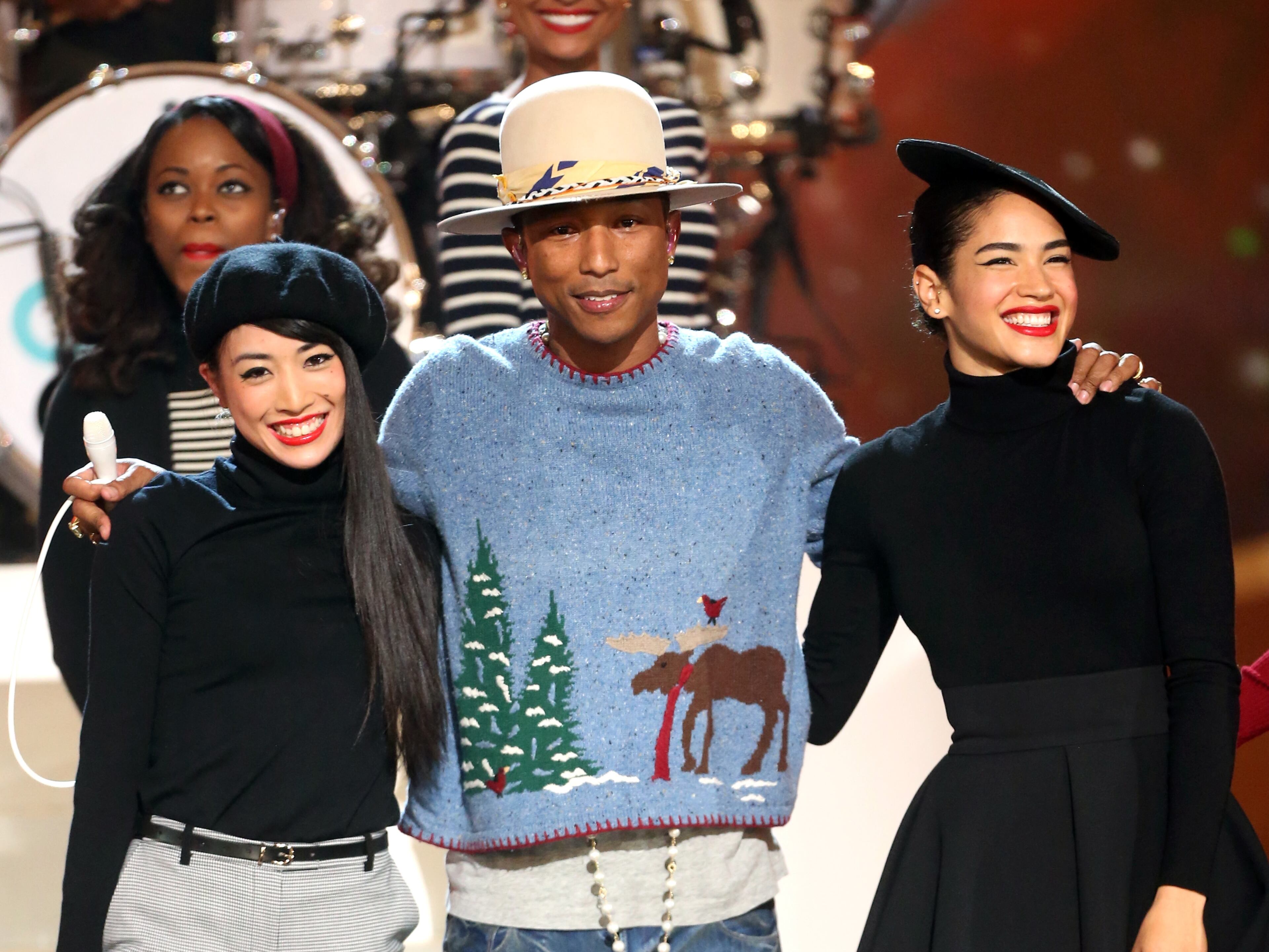 LOS ANGELES, CA - NOVEMBER 18: Musician Pharrell Williams (C) performs onstage during A VERY GRAMMY CHRISTMAS at The Shrine Auditorium on November 18, 2014 in Los Angeles, California. (Photo by Frederick M. Brown/Getty Images)
