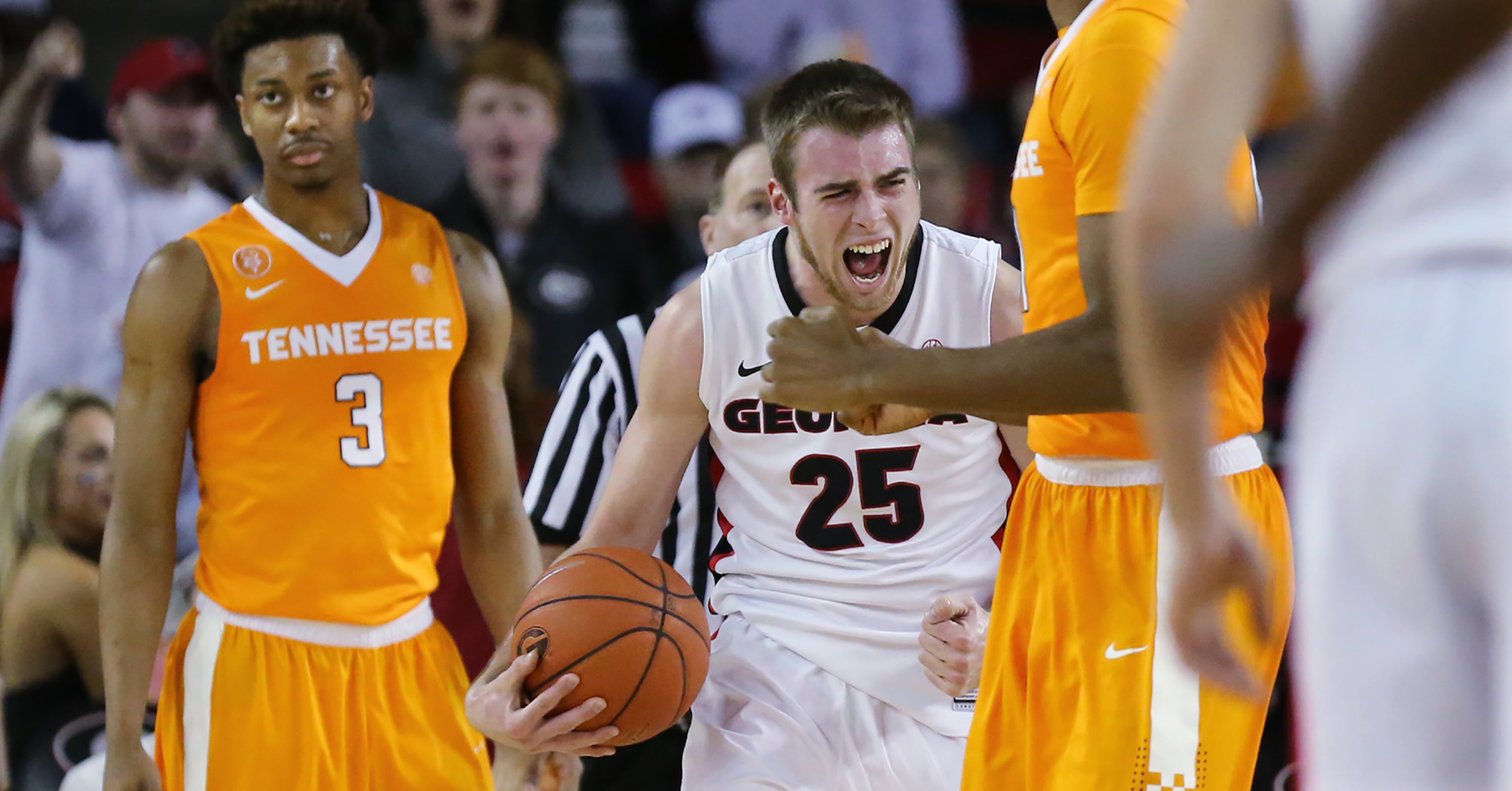 Georgia forward Kenny Paul Geno reacts to forcing a turnover by Tennessee guard Robert Hubbs III (left) during the second half in a basketball game on Wednesday, Jan. 13, 2016, in Athens. Georgia beat Tennessee 81-72. Curtis Compton / ccompton@ajc.com