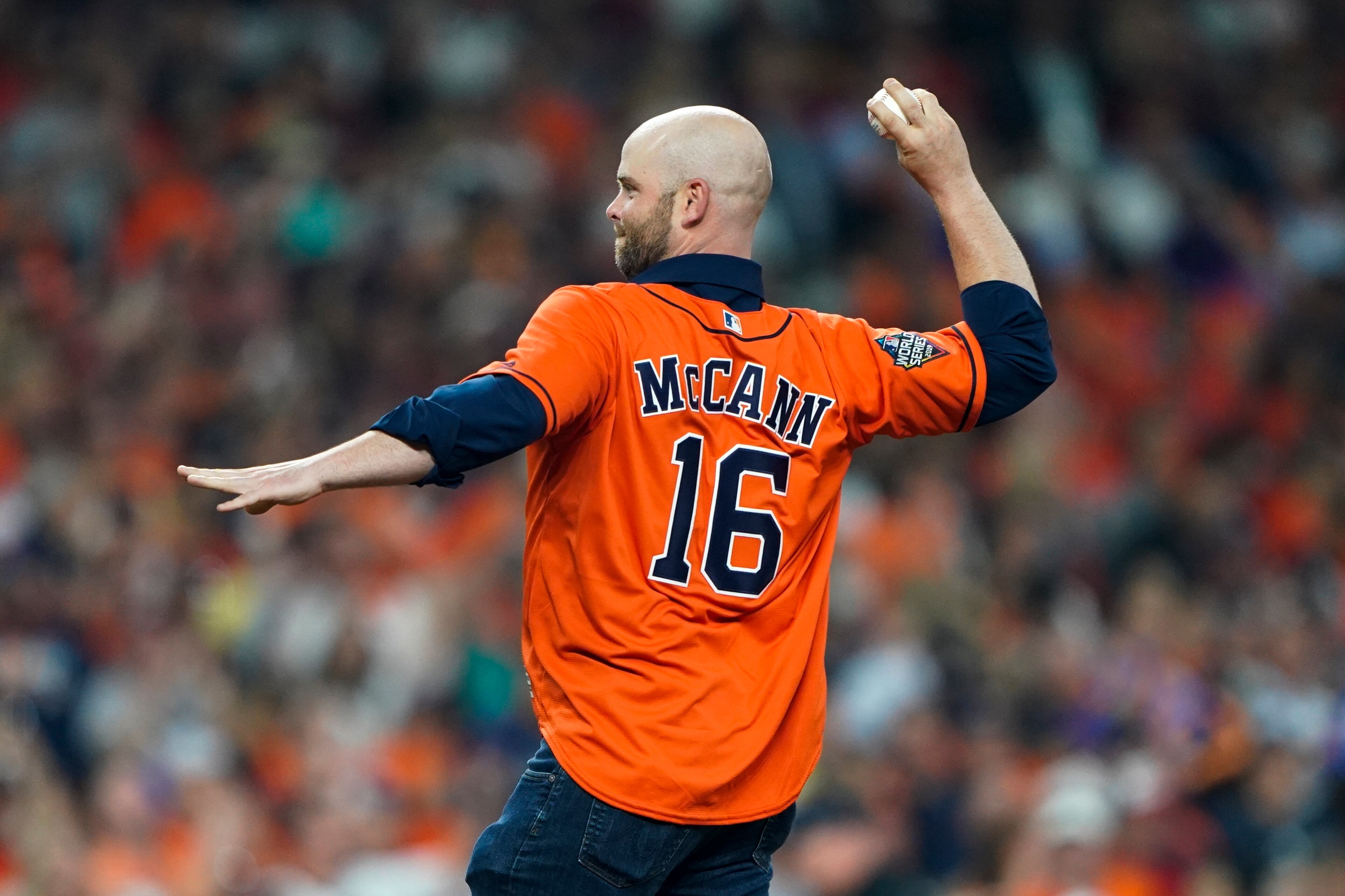Brian McCann throws out a ceremonial first pitch before Game 1 of the baseball World Series between the Houston Astros and the Washington Nationals Tuesday, Oct. 22, 2019, in Houston. (AP Photo/David J. Phillip)
