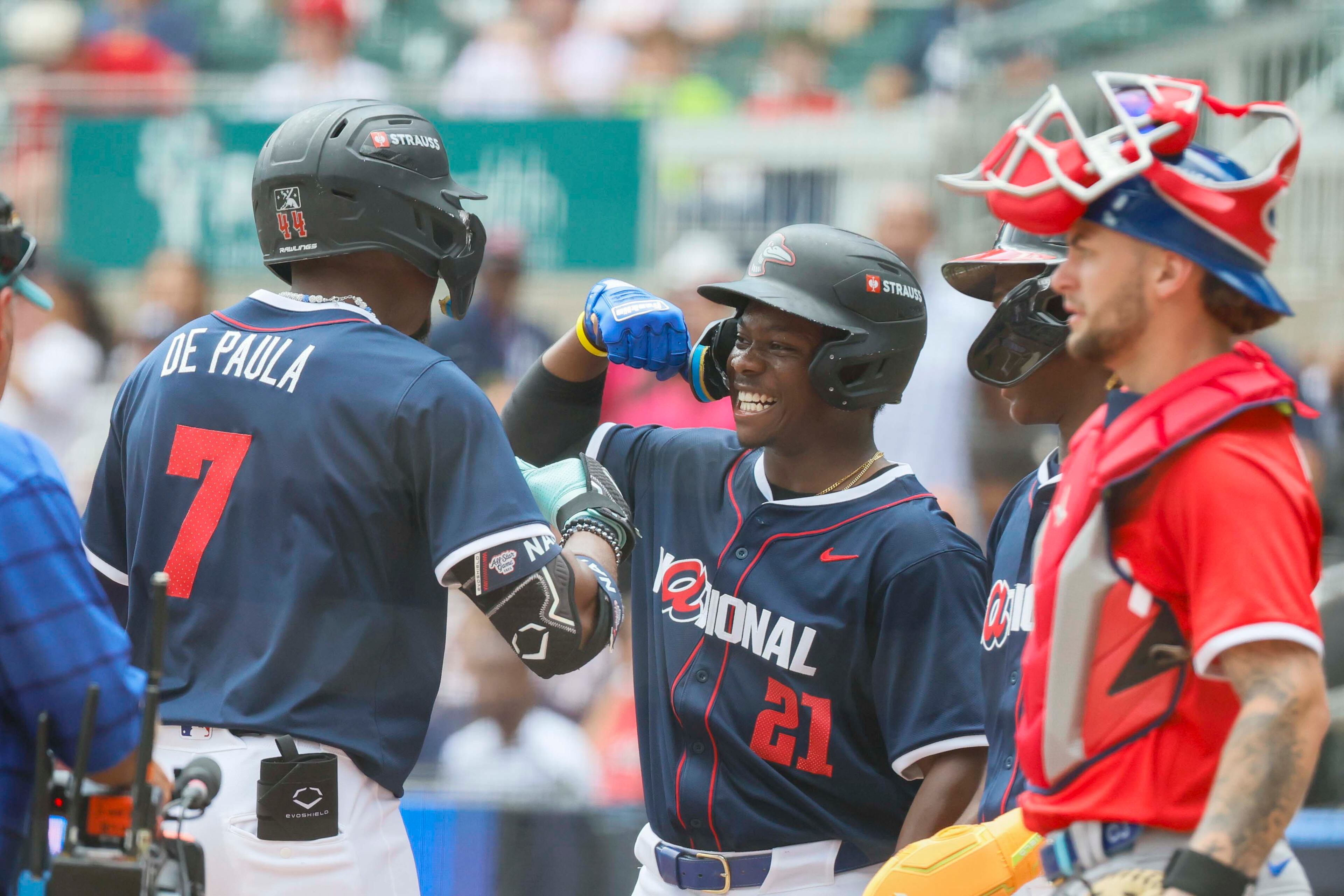 \National League outfielder Josue De Paula (7) of the Los Angeles Dodgers celebrates with outfielder Zyhir Hope (21) after his three-run home run during the MLB All-Star Futures Game at Truist Park on Saturday, July 12, 2025, in Atlanta.
(Miguel Martinez/ AJC)