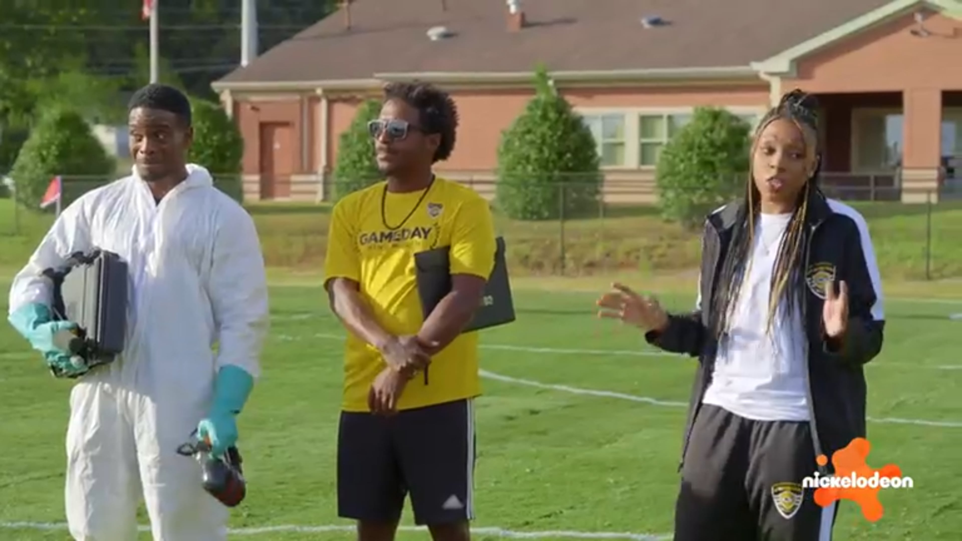 Kel Mitchell (left) and Renee Montgomery (right) help Sporting Club Stockbridge Soccer Academy and coach Damian Thompson during the first episode of Nickelodeon's “Play It Forward,” shot in metro Atlanta. (Nickelodeon)