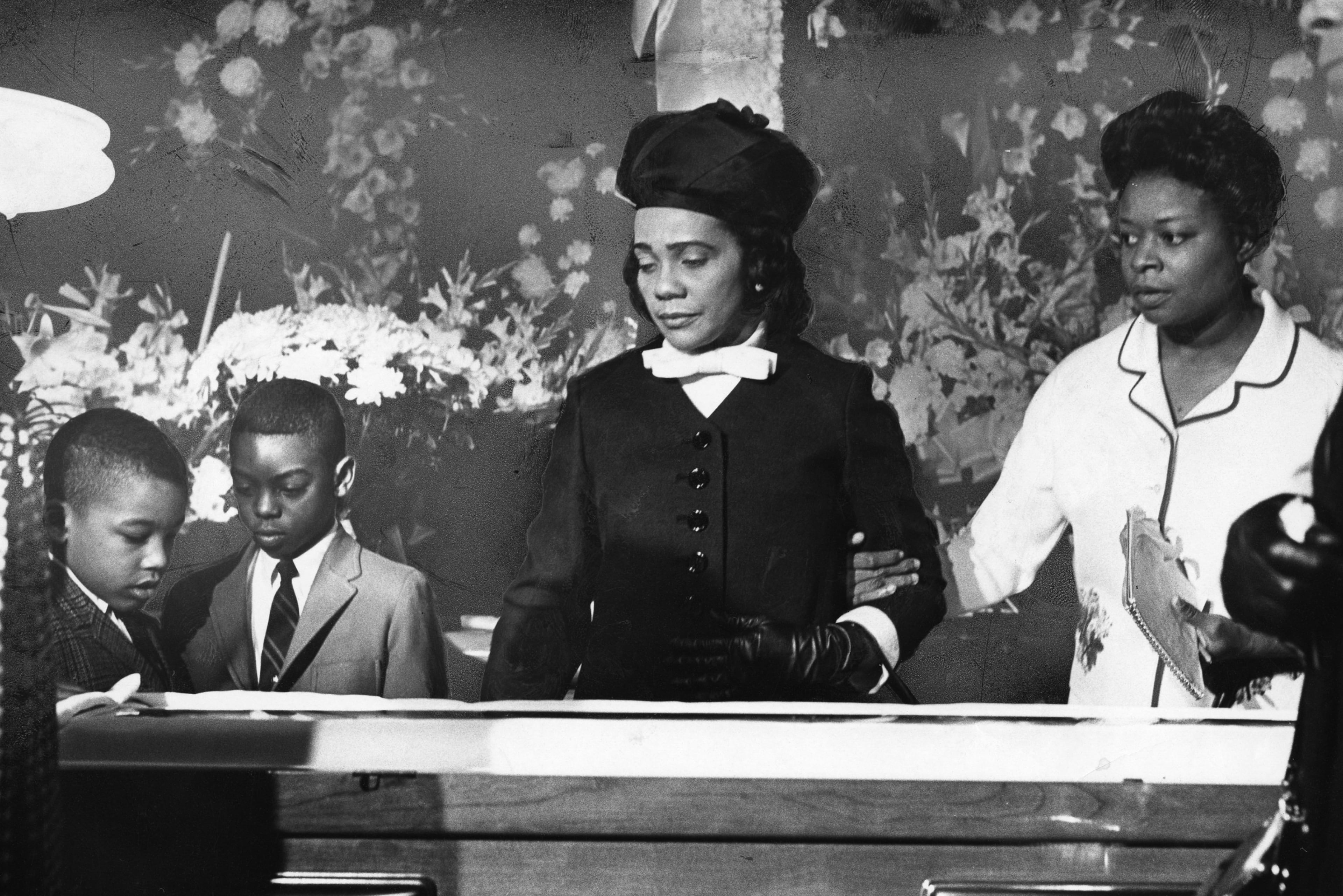 Coretta Scott King (second from right) attends the funeral service and casket viewing of husband Martin Luther King Jr. with family in Atlanta in April 1968. (Dwight Ross, Jr./The Atlanta Journal-Constitution Photographic Archives. Special Collections and Archives, Georgia State University Library)