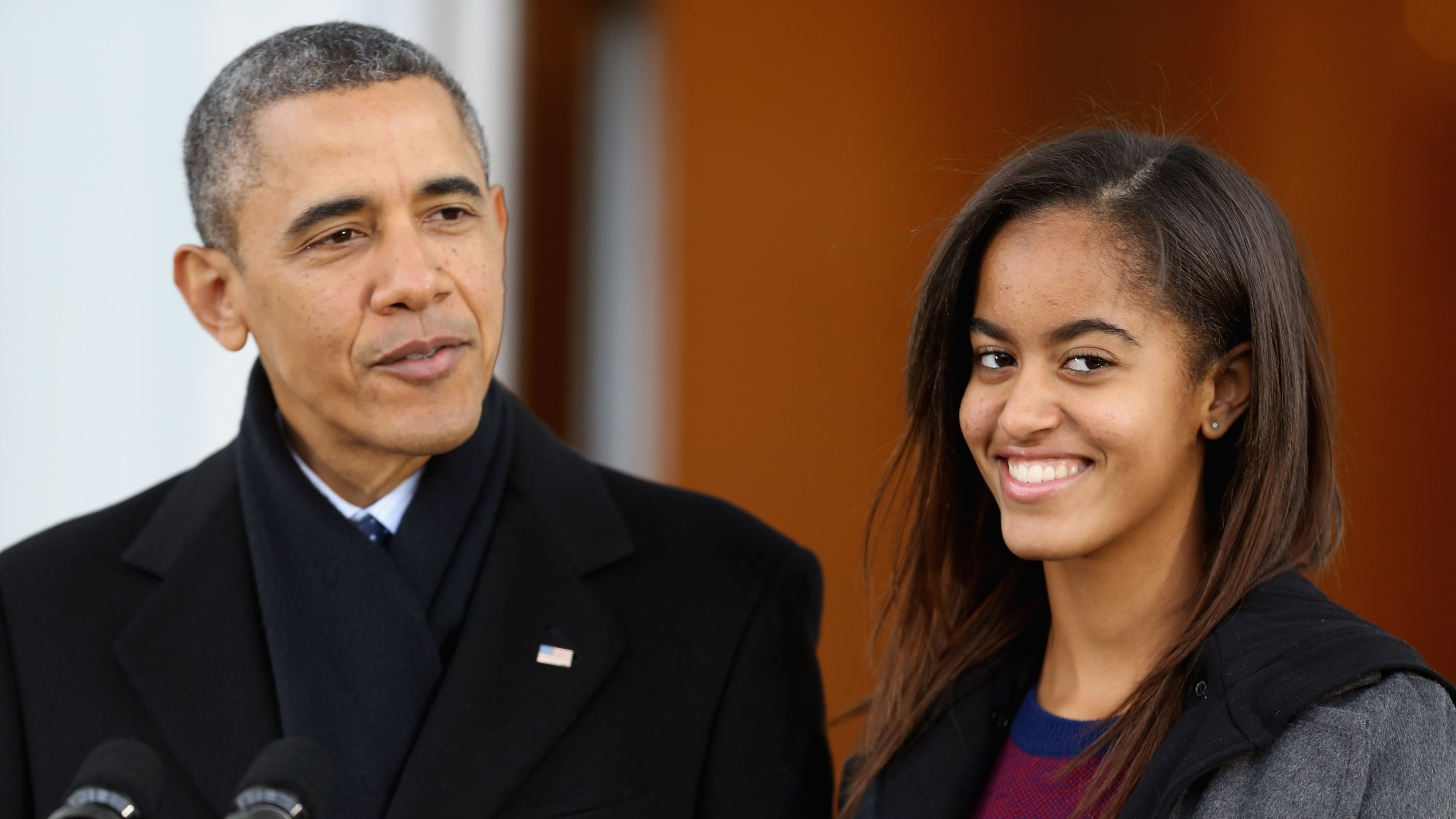 WASHINGTON, DC - NOVEMBER 27: U.S. President Barack Obama delivers remarks with his daughter, Malia Obama, before pardoning the 2013 National Thanksgiving Turkey, 'Popcorn' on the North Portico of the White House November 27, 2013 in Washington, DC. A 38-pound, full-grown Broad Breasted White domesticated turkey, 'Popcorn' and its alternate 'Caramel' will be sent to live at Mount Vernon, the estate and home of George Washington. (Photo by Chip Somodevilla/Getty Images)