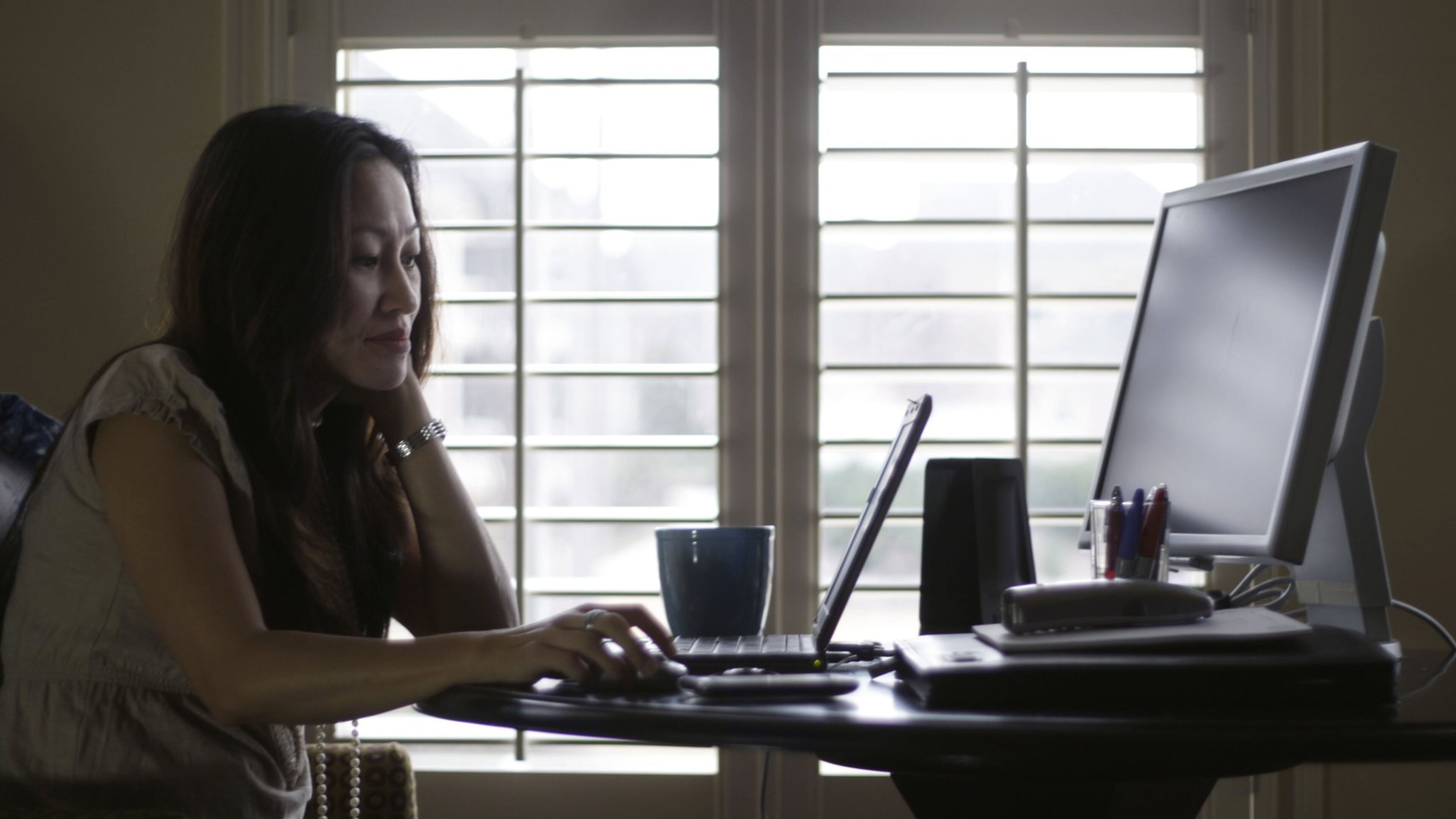 Denise Kenson-Liu (shown here in a 2011 photo) has been teleworking since about 2007, but experts say that in the wake of the coronavirus, this could become our new normal. BOB ANDRES / BANDRES@AJC.COM