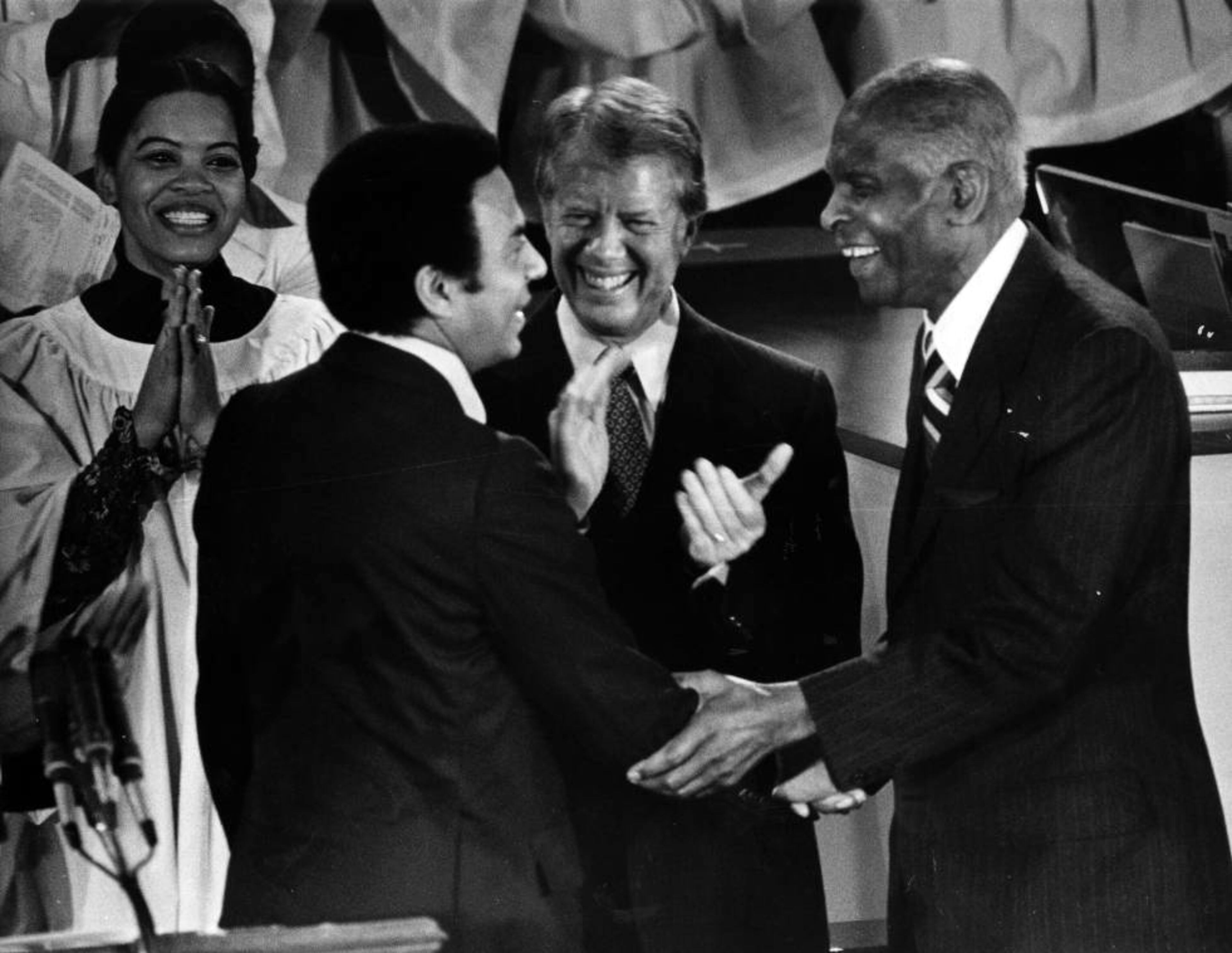 Mayor Andrew Young meeting with President Jimmy Carter and Dr. Benjamin Mays during a ceremony, January 1979