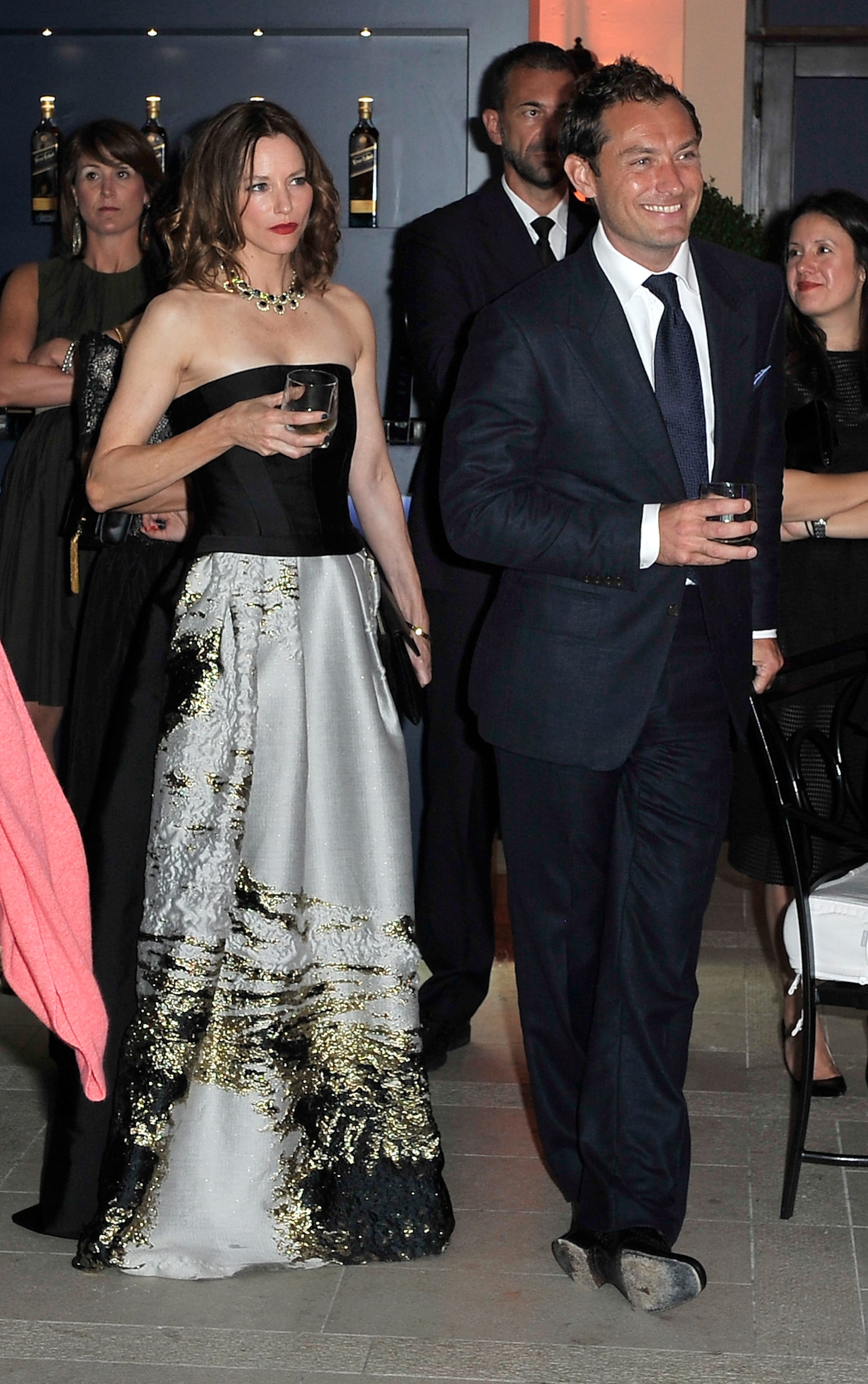 VENICE, ITALY - AUGUST 27: Jude Law and Sienna Guillory attend the JOHNNIE WALKER BLUE LABEL reception at Venice Film Festival, for short film The Gentleman’s Wager starring Jude Law and Giancarlo Giannini on August 27, 2014 in Venice, Italy. To view The Gentleman’s Wager: (Photo by Gareth Cattermole/Getty Images for Johnnie Walker Blue Label)