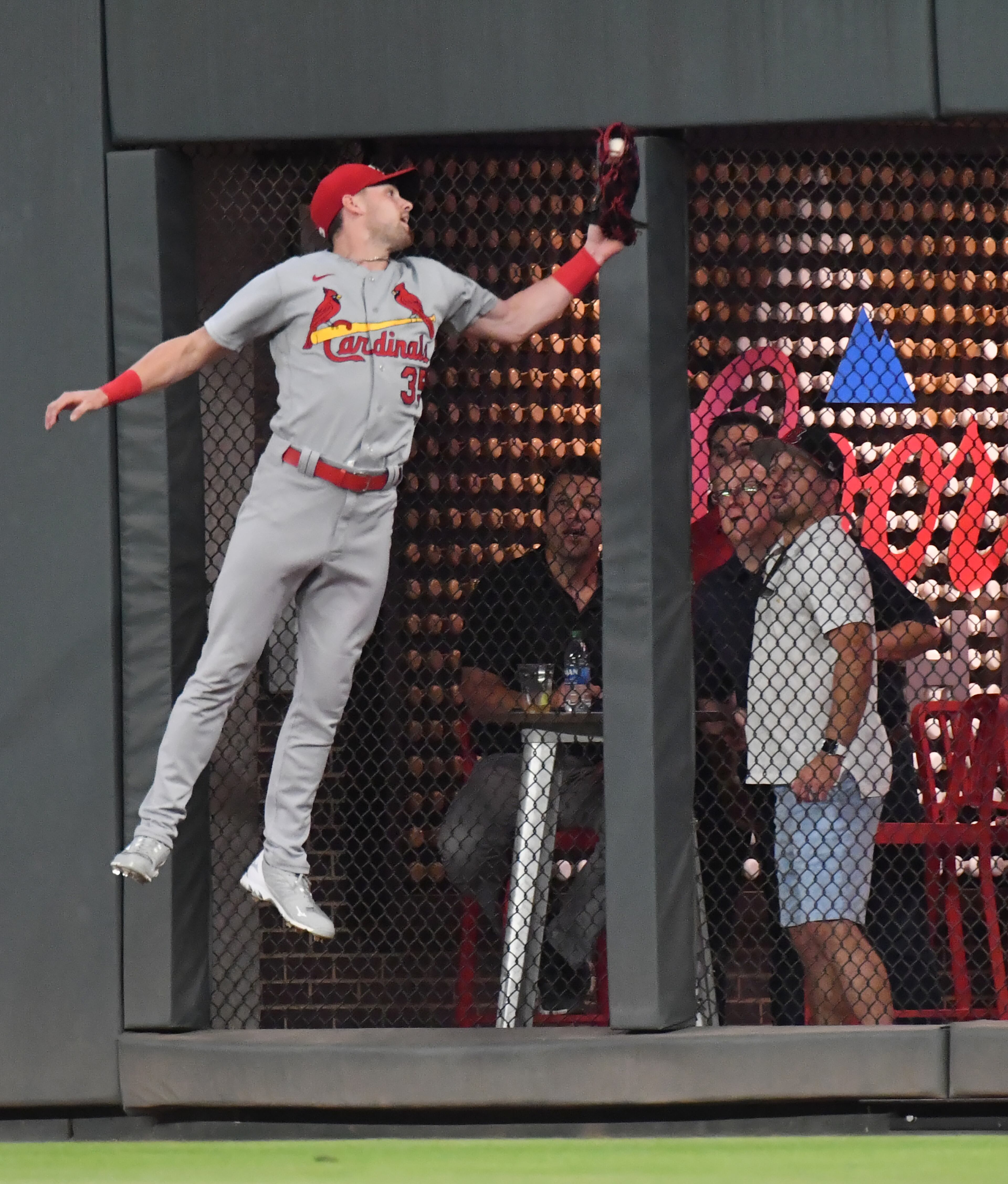 St. Louis Cardinals left fielder Lane Thomas (35) catches a fly ball by Atlanta Braves third baseman Austin Riley (27) in the 8th inning. (Hyosub Shin / Hyosub.Shin@ajc.com)