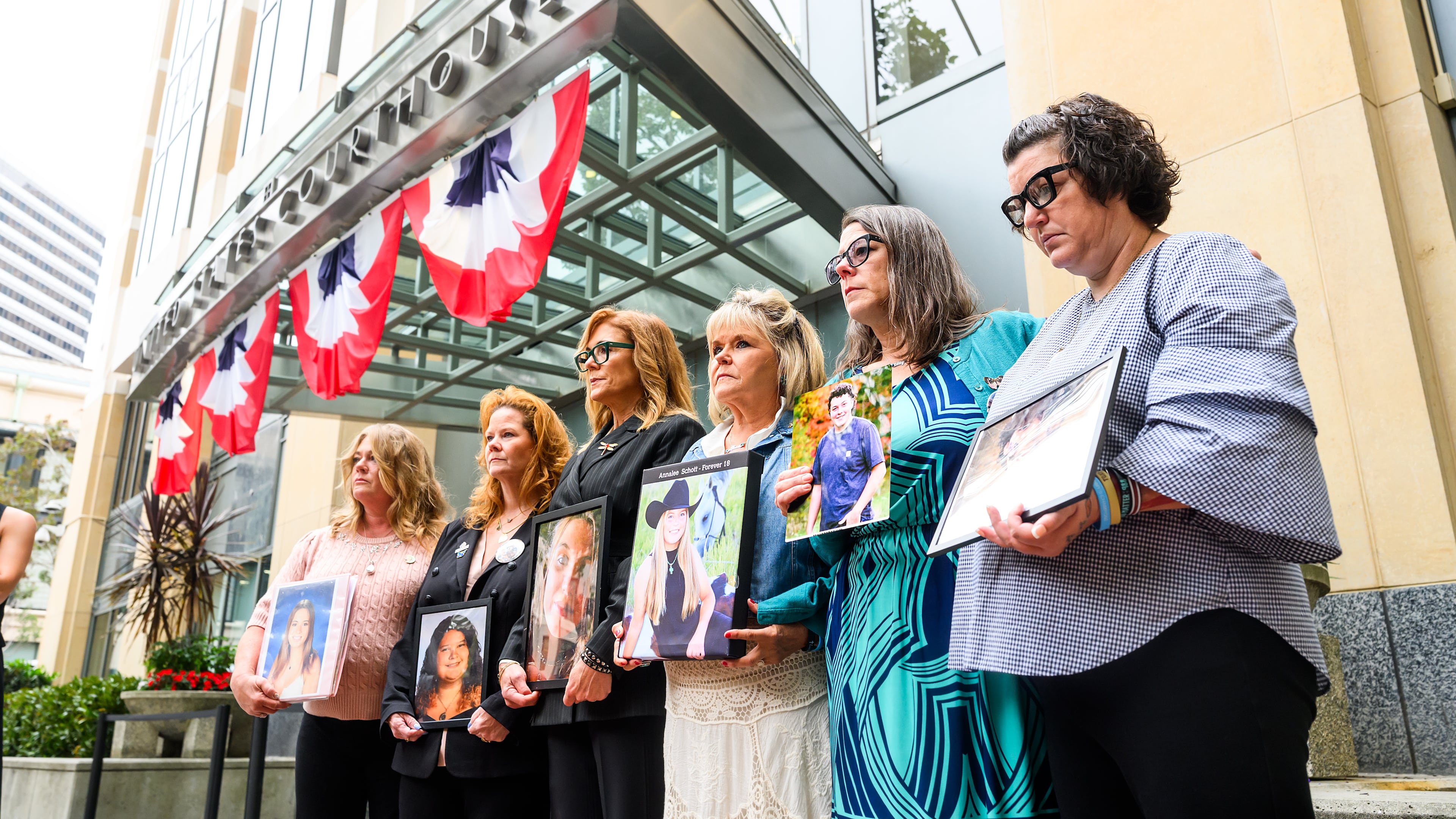 Parents hold pictures of their deceased children during a protest against social media platforms outside the Ronald V. Dellums Federal Building and U.S. Courthouse on Tuesday, Aug. 18, 2026, in Oakland, Calif. (AP Photo/Noah Berger)