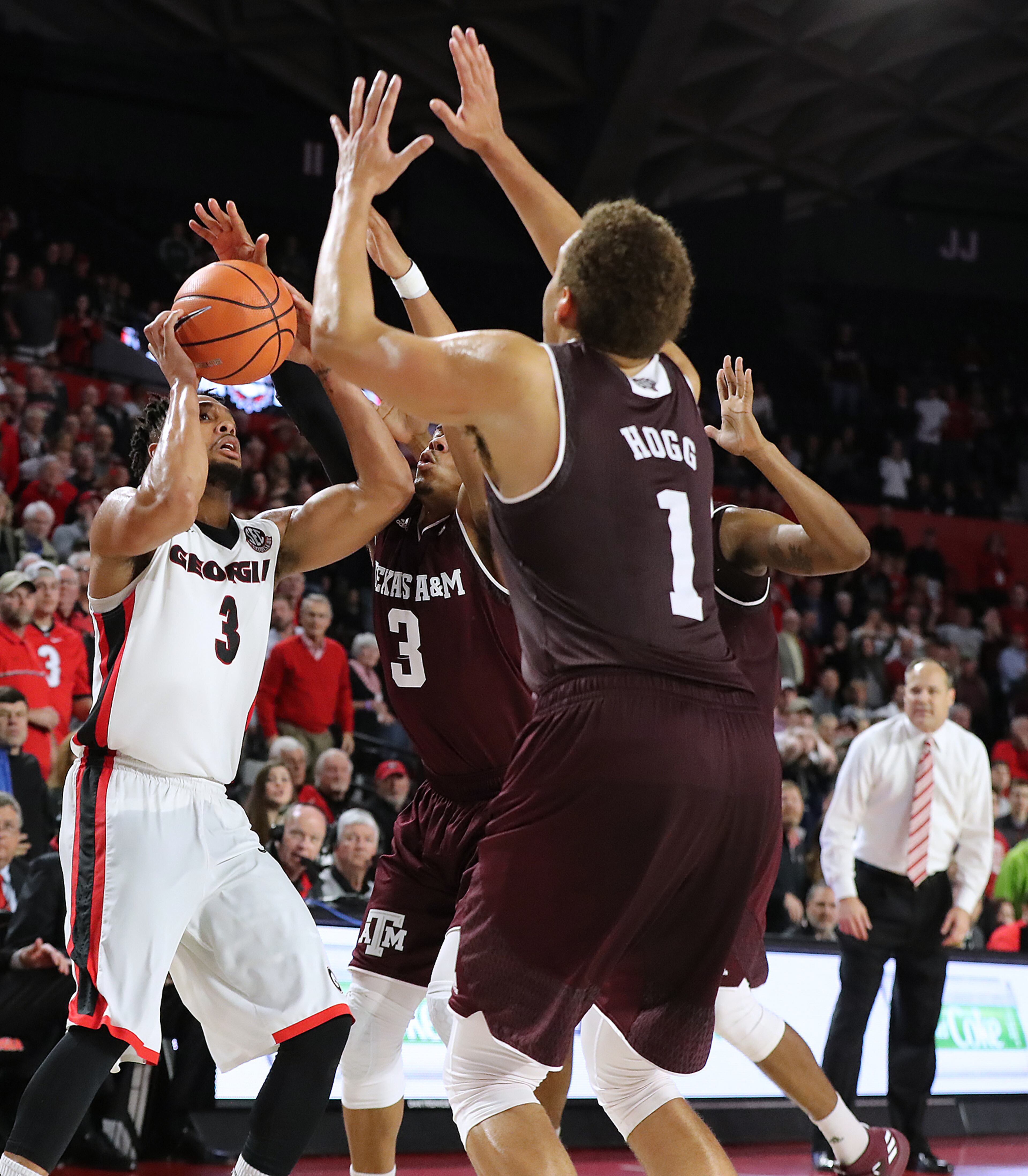 Feb 28, 2018 Athens: Texas A&M defenders smother Georgia guard Juwan Parker as he misses the last shot of the game with head coach Mark Fox looking on in a 61-60 loss to Texas A&M in their NCAA college basketball game on Wednesday, Feb 28, 2018, in Athens. Curtis Compton/ccompton@ajc.com