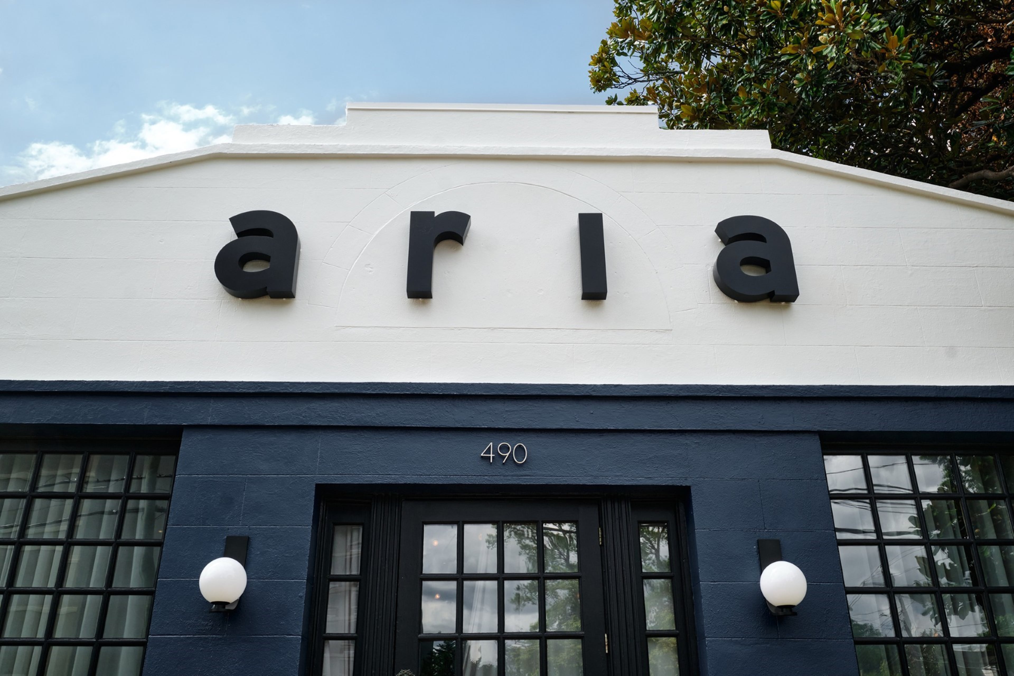 Aria's exterior in August 2025, which was painted with accents in Newburyport Blue. (Credit: Brandon Amato, courtesy of Aria)