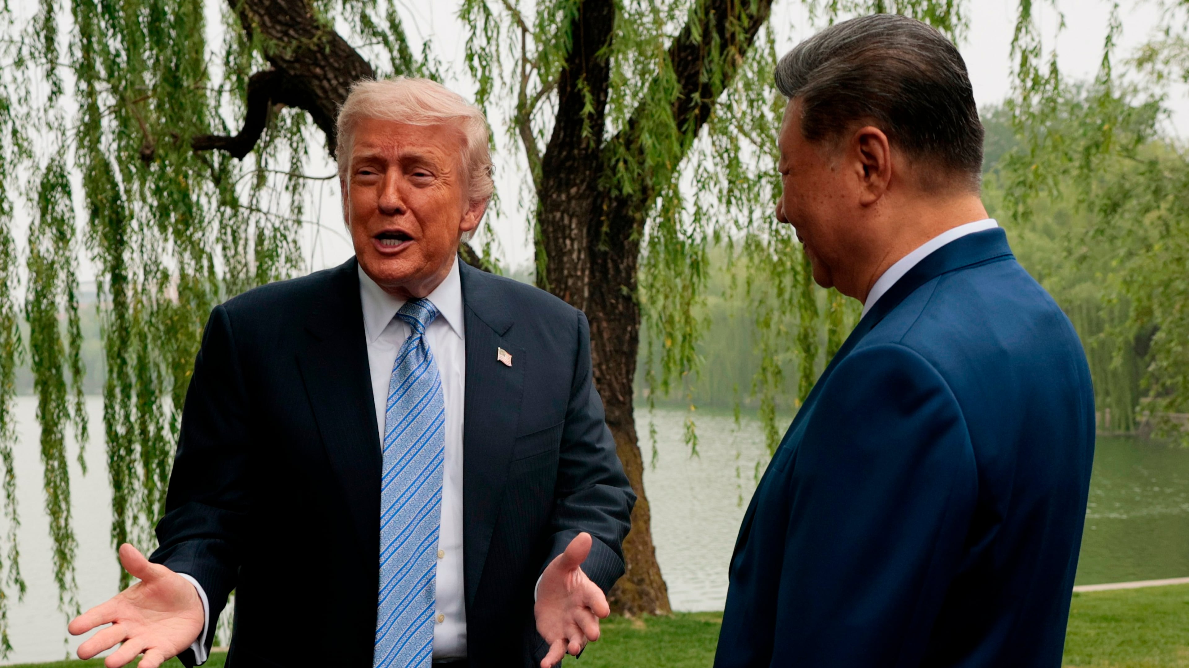 U.S. President Donald Trump, left, speaks as he is greeted by Chinese President Xi Jinping at Zhongnanhai Garden in Beijing, China, Friday, May 15, 2026. (Evan Vucci/Pool Photo via AP)