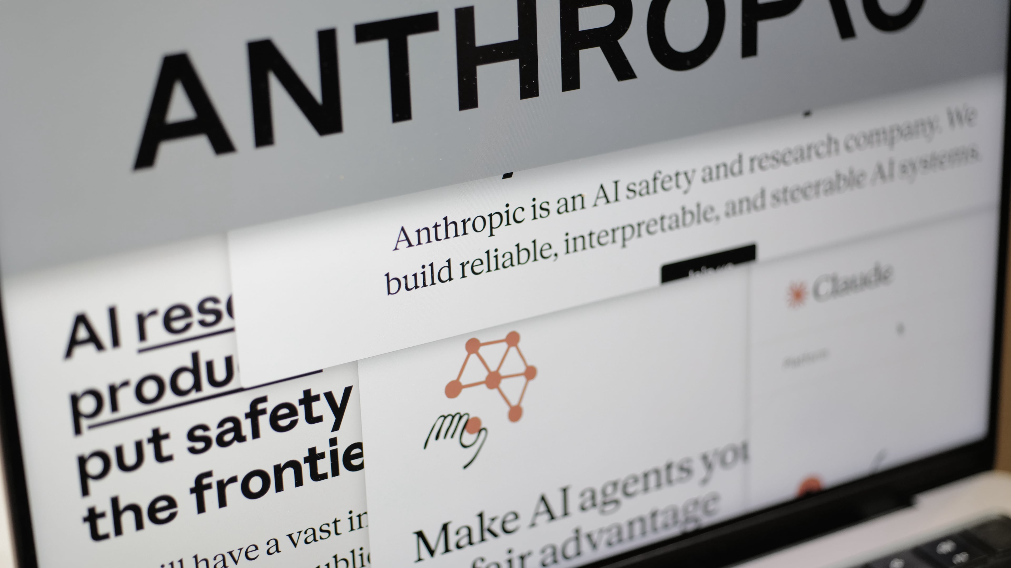 FILE - Pages from the Anthropic website and the company's logo are displayed on a computer screen in New York on Feb. 26, 2026. (AP Photo/Patrick Sison, File)