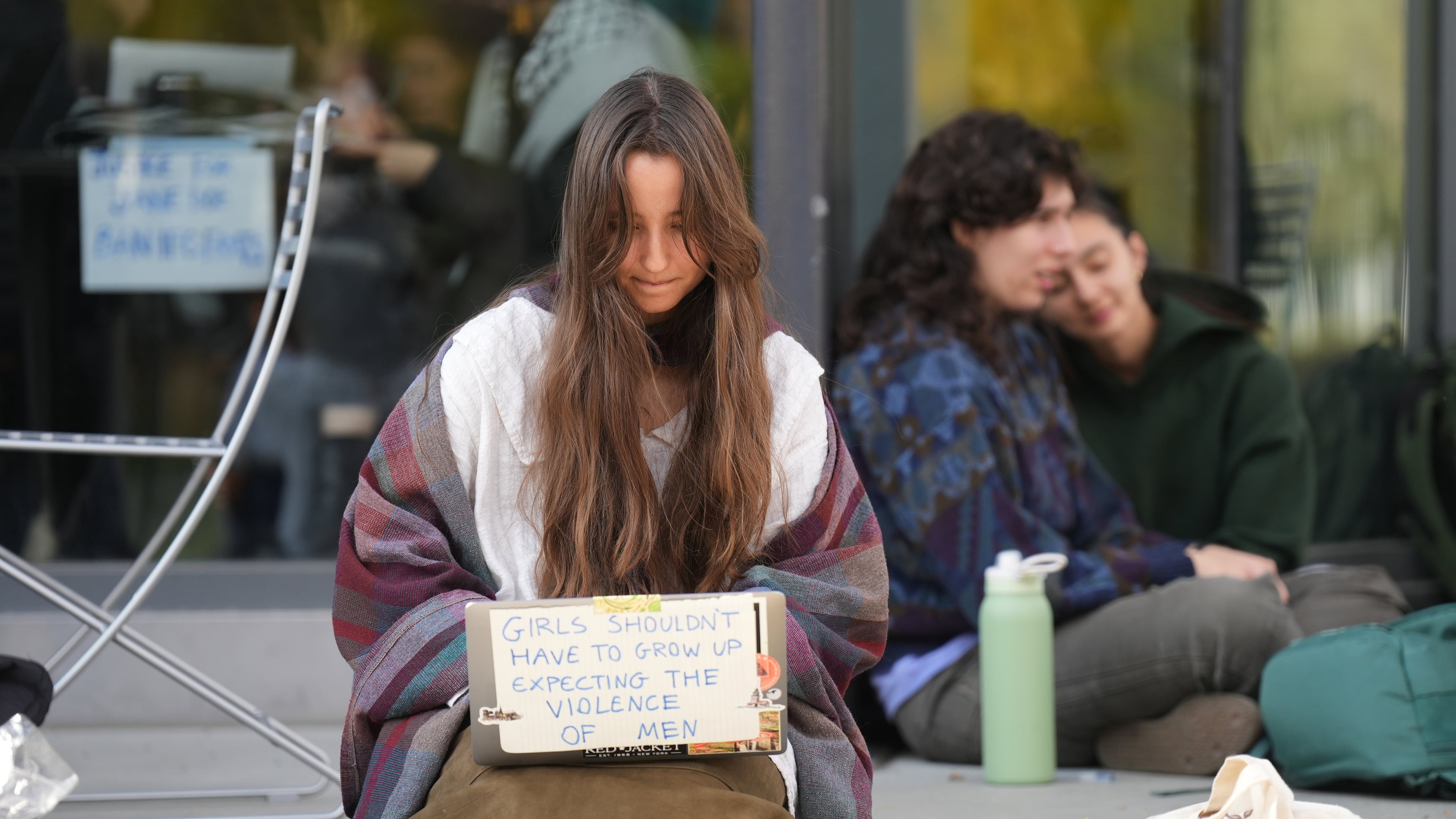 Student Isabel Breslin works on her laptop during a sit-in protest at Cornell University, Wednesday, Oct. 7, 2026, in Ithaca, N.Y. (AP Photo/Matt Burkhartt)