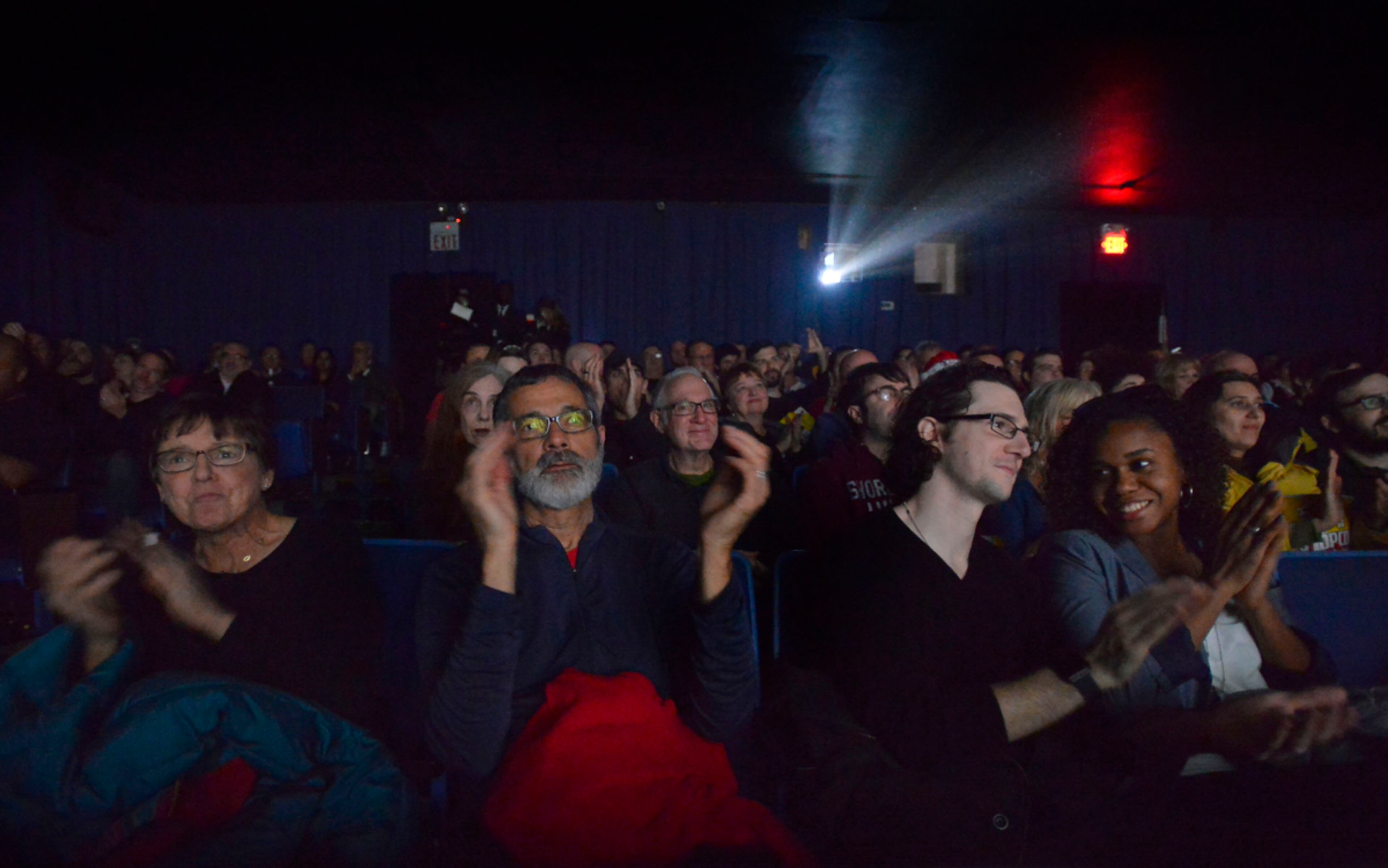 WATCHING THE FLICK--Moviegoers applaud the opening of the Sony Pictures movie "The Interview" at the Plaza Theatre's first screening of the film on Christmas Day, Thursday, Dec. 25, 2014, in Atlanta. David Tulis/AJC Special