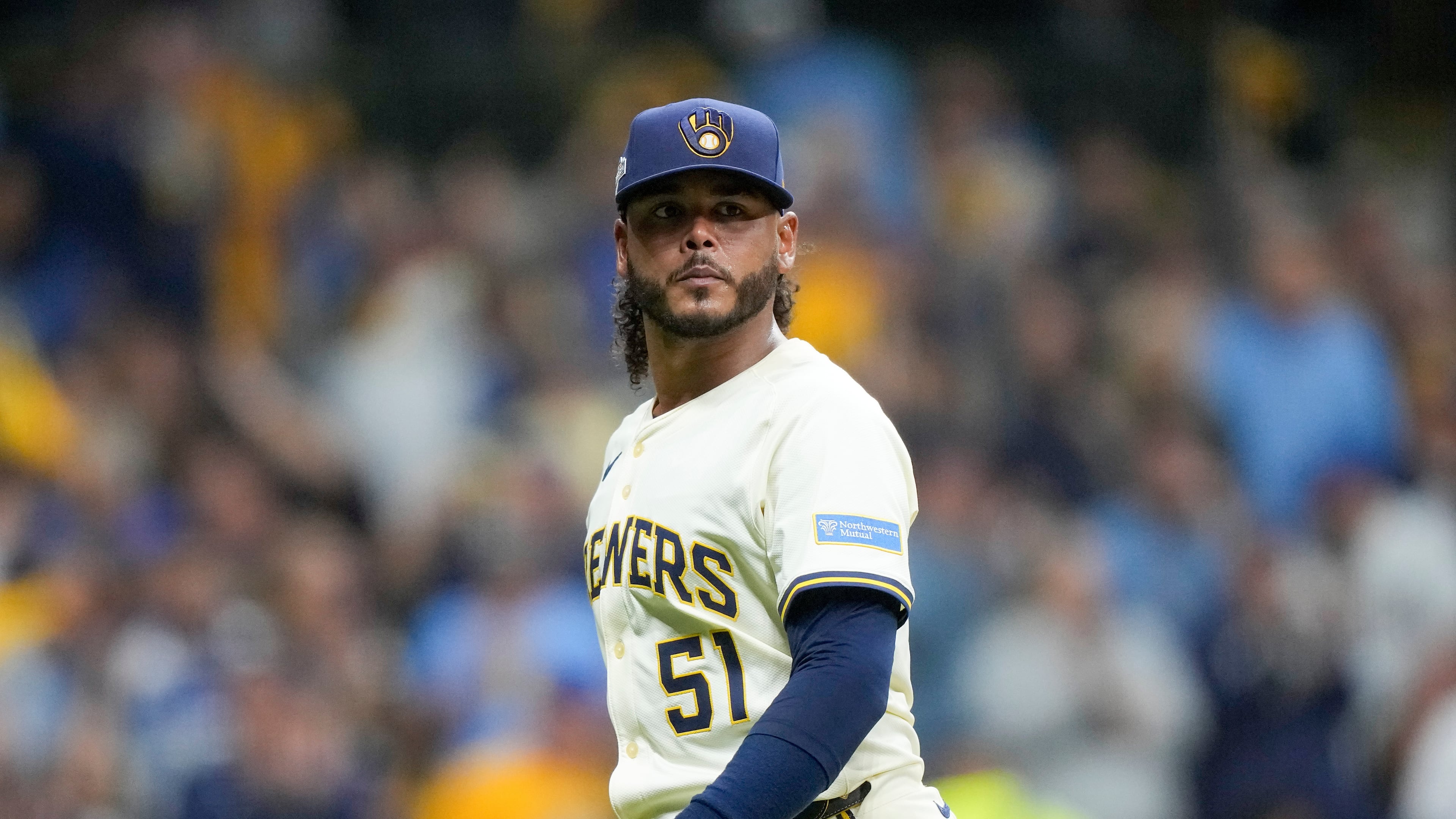 FILE - Milwaukee Brewers pitcher Freddy Peralta walks to the dugout after the top of the fifth inning in Game 2 of baseball's National League Championship Series against the Los Angeles Dodgers, Oct. 14, 2025, in Milwaukee. (AP Photo/Brynn Anderson, File)