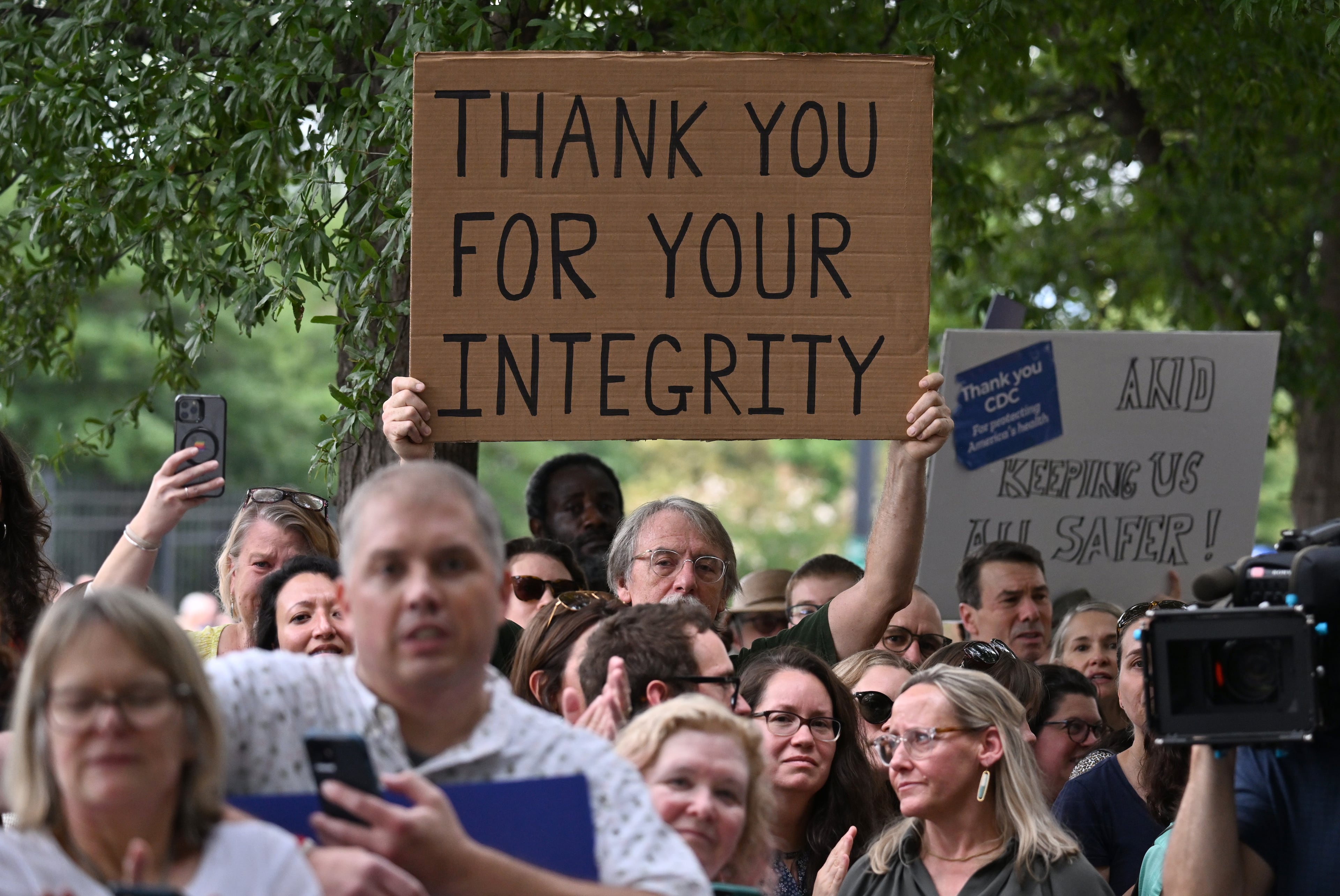 CDC staff and supporters hold signs as they gather to rally for departing leaders Debra Houry, Demetre Daskalakis, and Daniel Jernigan outside the CDC headquarters, Thursday, August 28, 2025, in Atlanta. Top leaders who resigned their positions at the US Centers for Disease Control and Prevention after the ouster of the agency’s director were escorted out of the building Thursday morning. (Hyosub Shin / AJC)