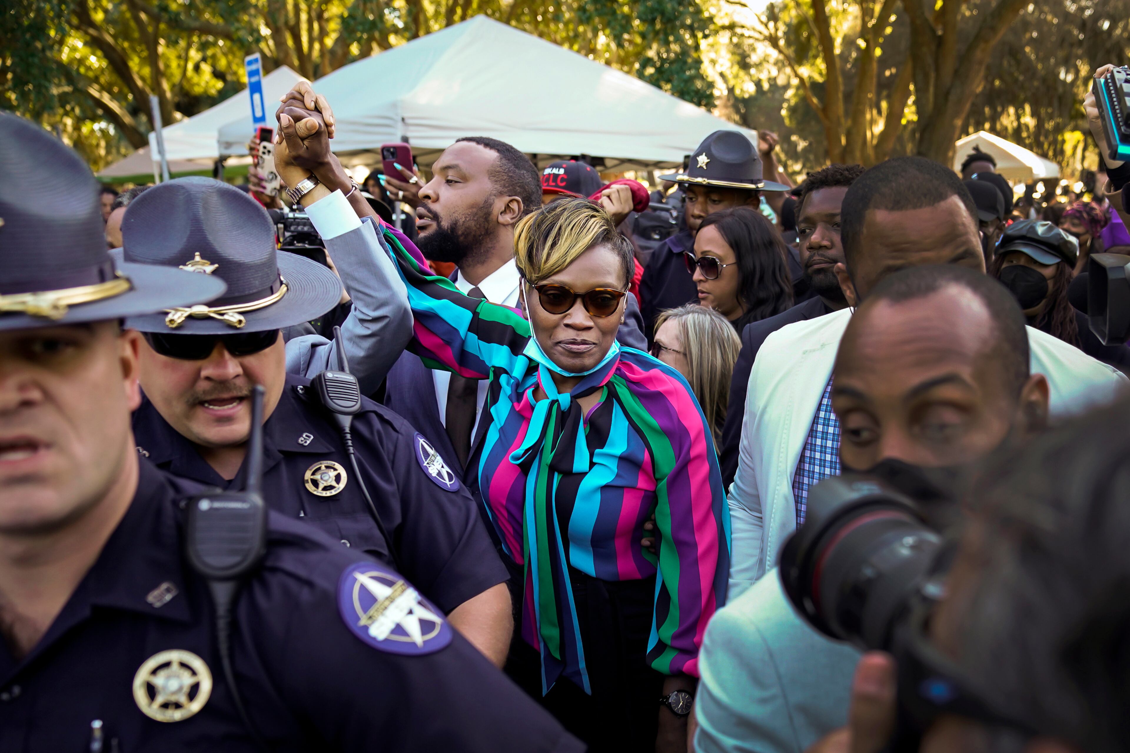 FILE — Wanda Cooper-Jones leaves the courthouse in Brunswick, Ga., on Nov. 24, 2021, after a jury found three white men guilty in the murder of her son Ahmaud Arbery. Both Travis McMichael, who fatally shot Arbery, and his father, Gregory McMichael, were sentenced to life in prison without the possibility of parole on Jan. 7, 2022. The third man convicted, William Bryan, faces a life sentence with the possibility of parole. (Nicole Craine/The New York Times)