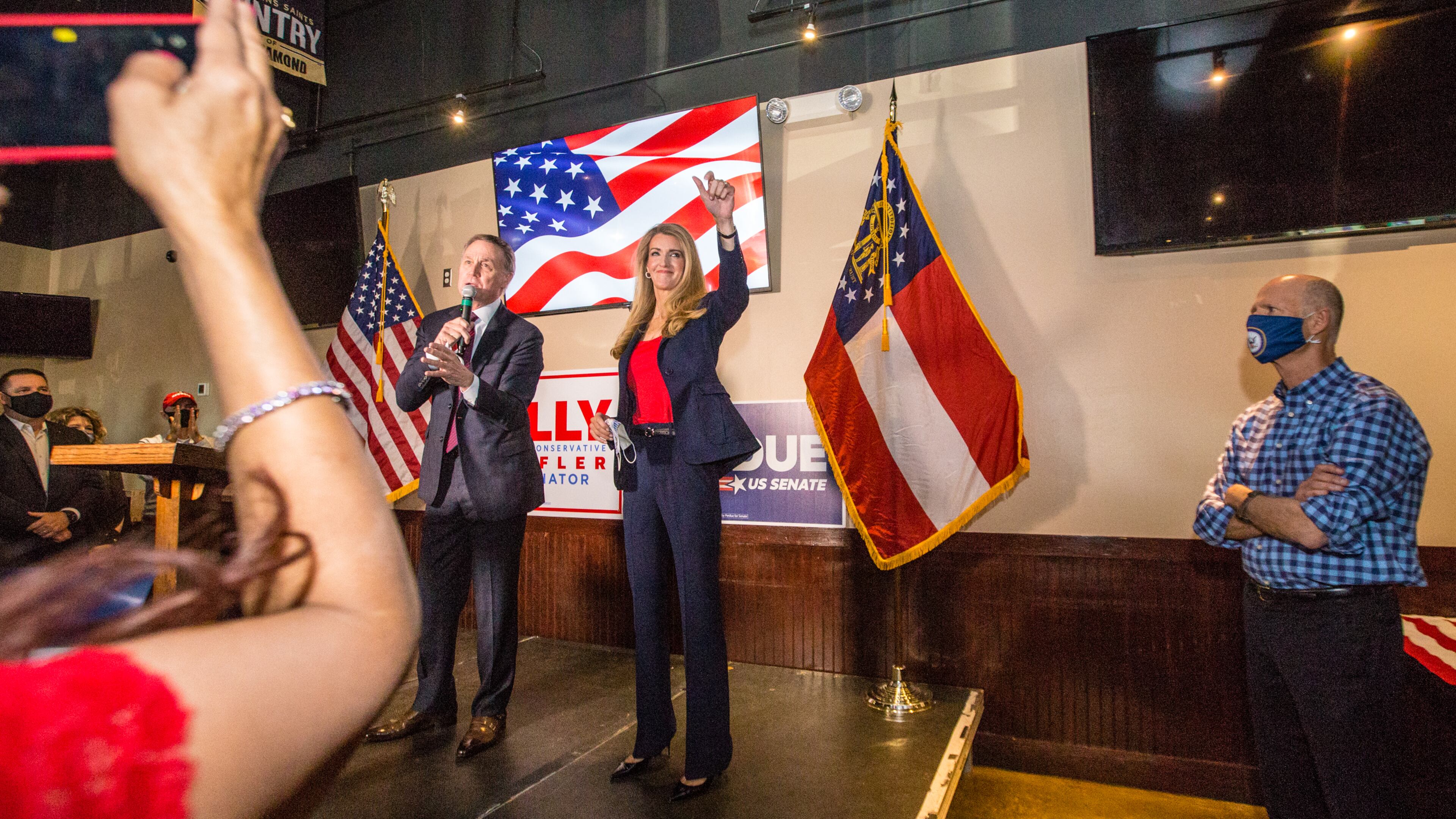 Senators David Perdue, left, Kelly Loeffler, center, and Florida Senator Rick Scott, right, joined together for a rally on Friday, November 13, 2020 at Black Diamond Grill in Cumming, GA. Both Georgia candidates head to a run-off election in January. (Jenni Girtman for The Atlanta Journal Constitution)
