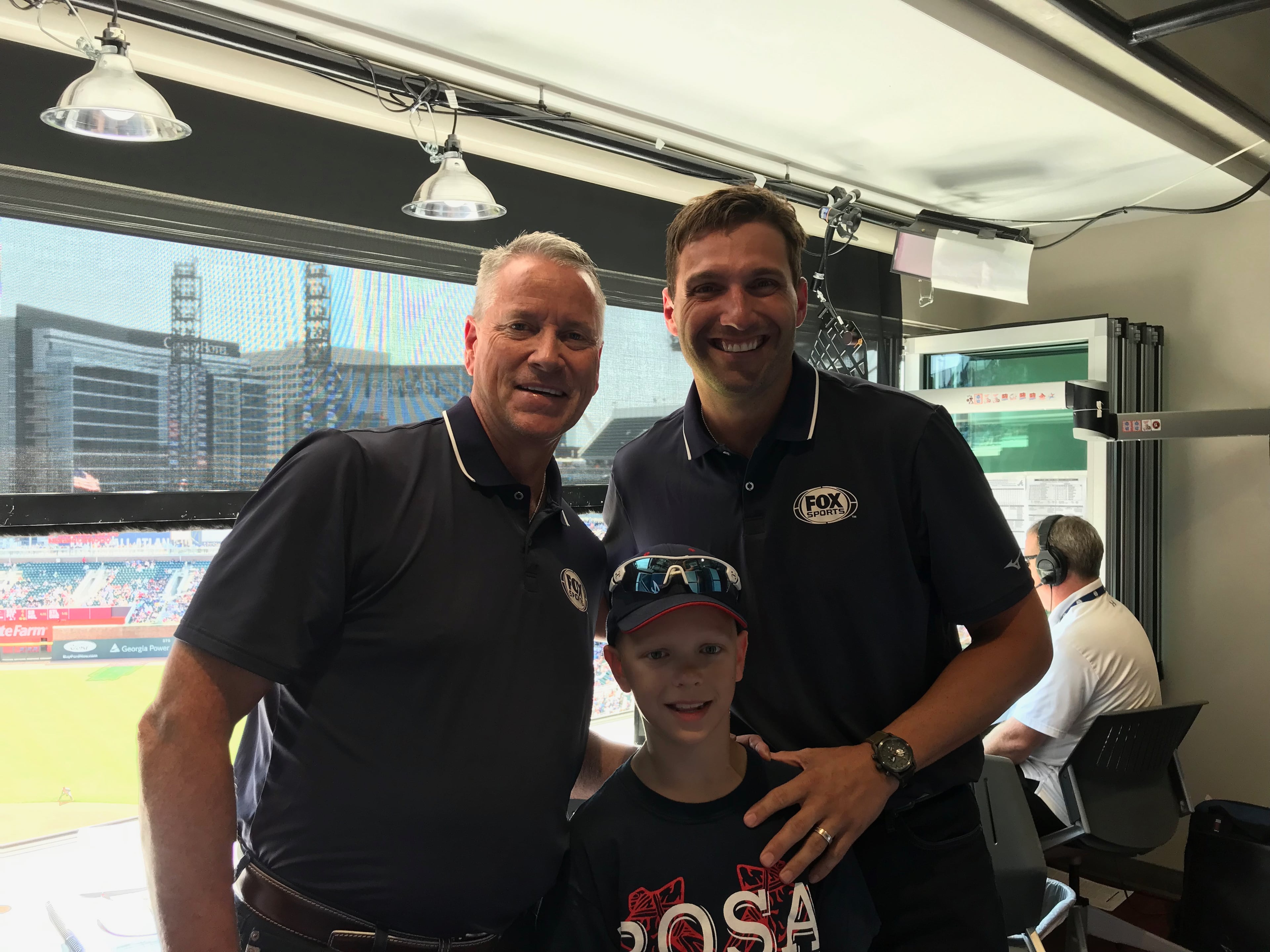 Sam with Tom Glavine and Jeff Francoeur in the broadcasters' booth.