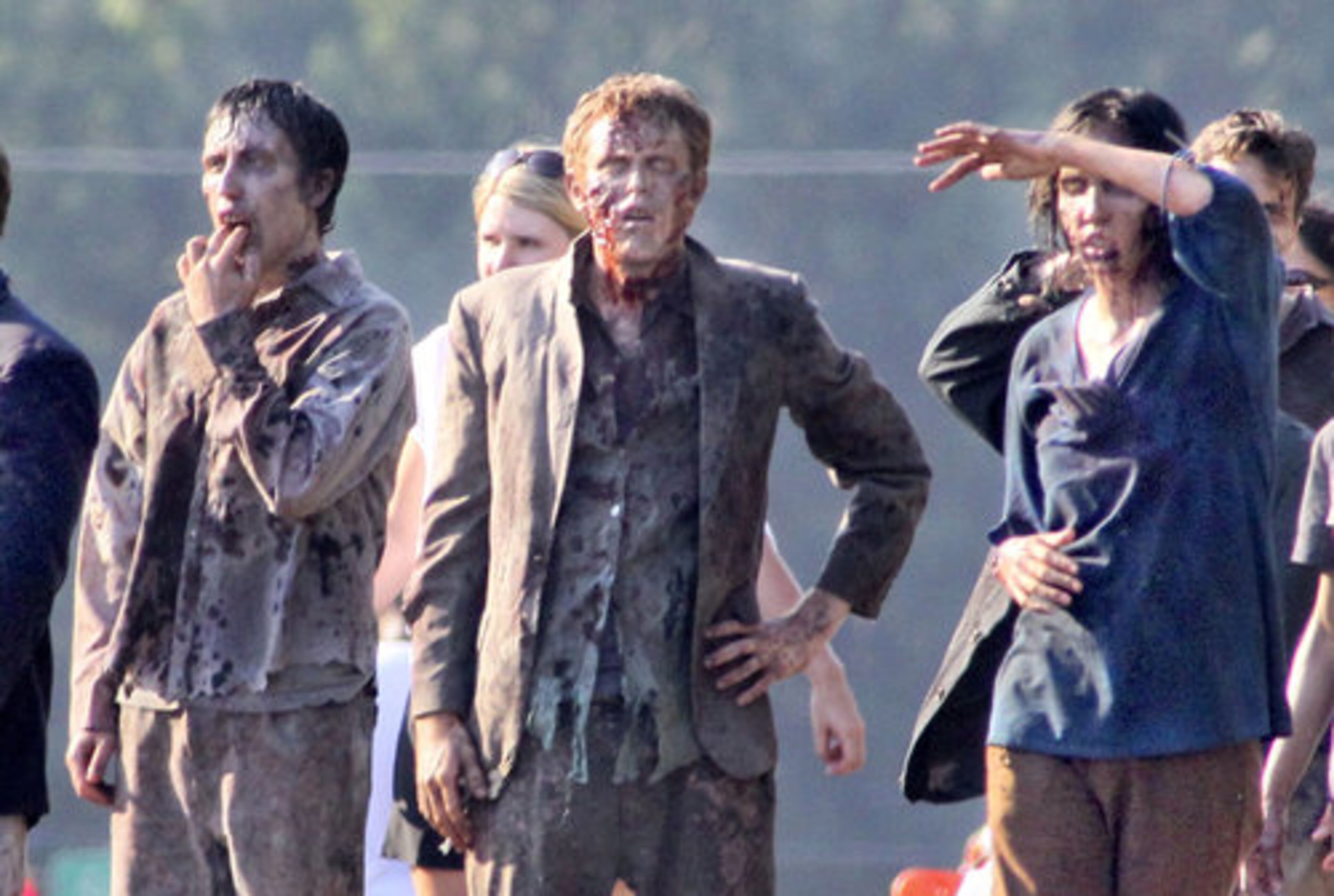 ZOMBIES INVADE COBB COUNTY: Zombies on the set wait to be qued Monday, June 13, 2011. Zombies took over a Cobb County office park Monday, as filming of the hit AMC series, "The Walking Dead" moved into the Vinings area