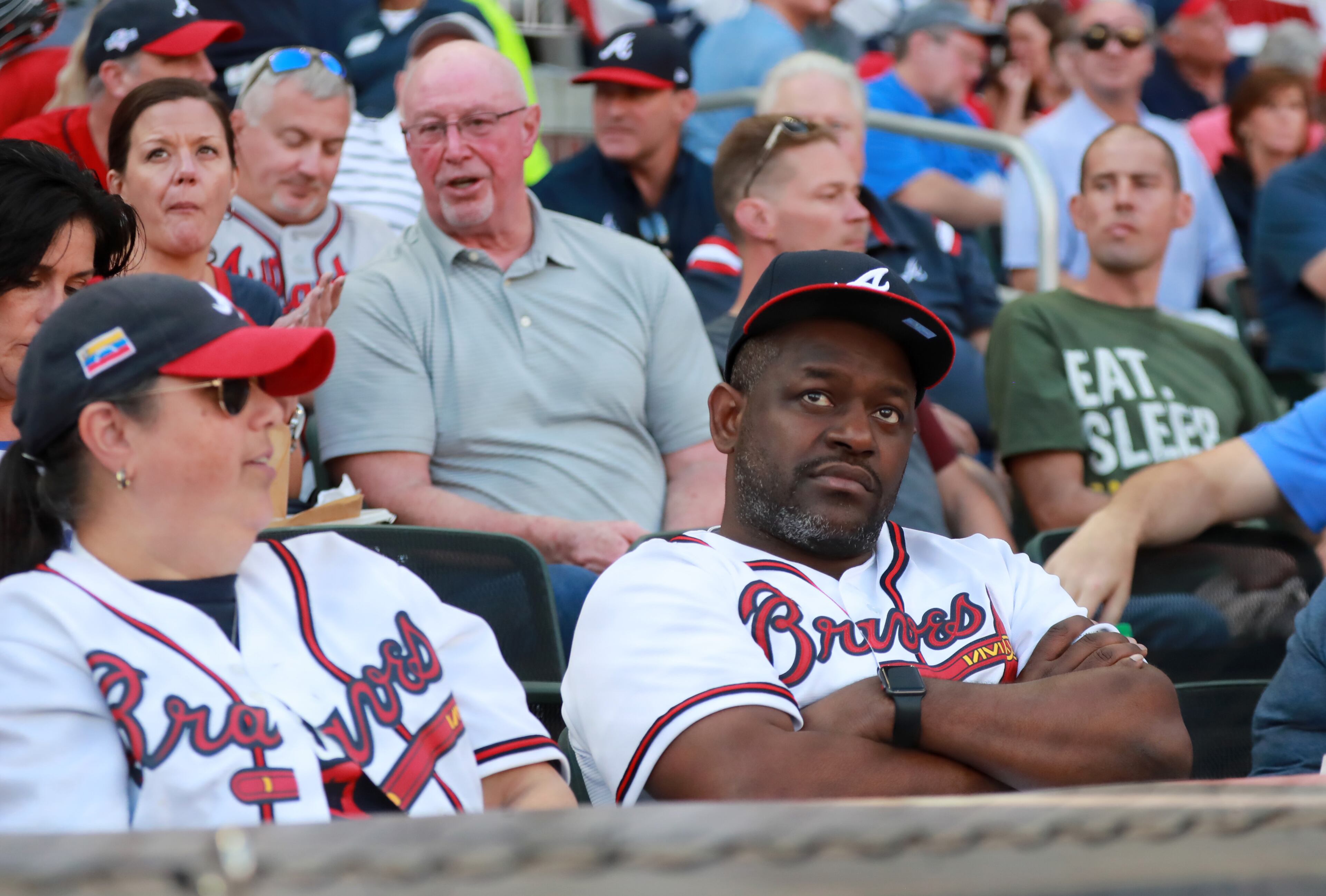 Braves fans react in shock after the team allowed 11 runs in the first two innings. Curtis Compton/ccompton@ajc.com