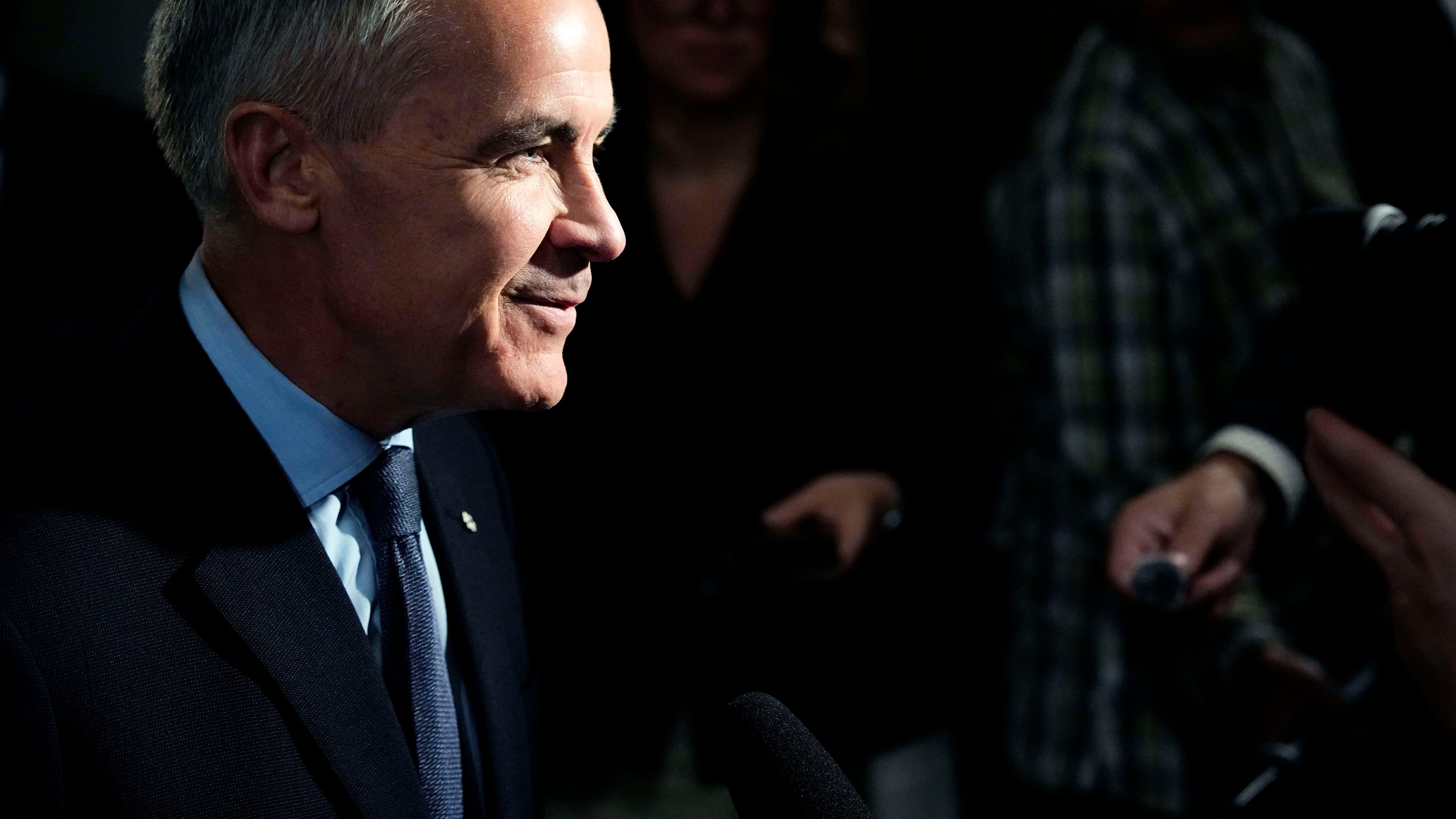 Prime Minister Mark Carney takes questions from journalists as he arrives for a meeting of the federal cabinet on Parliament Hill in Ottawa, on Tuesday, Oct. 20, 2026. (Justin Tang /The Canadian Press via AP)