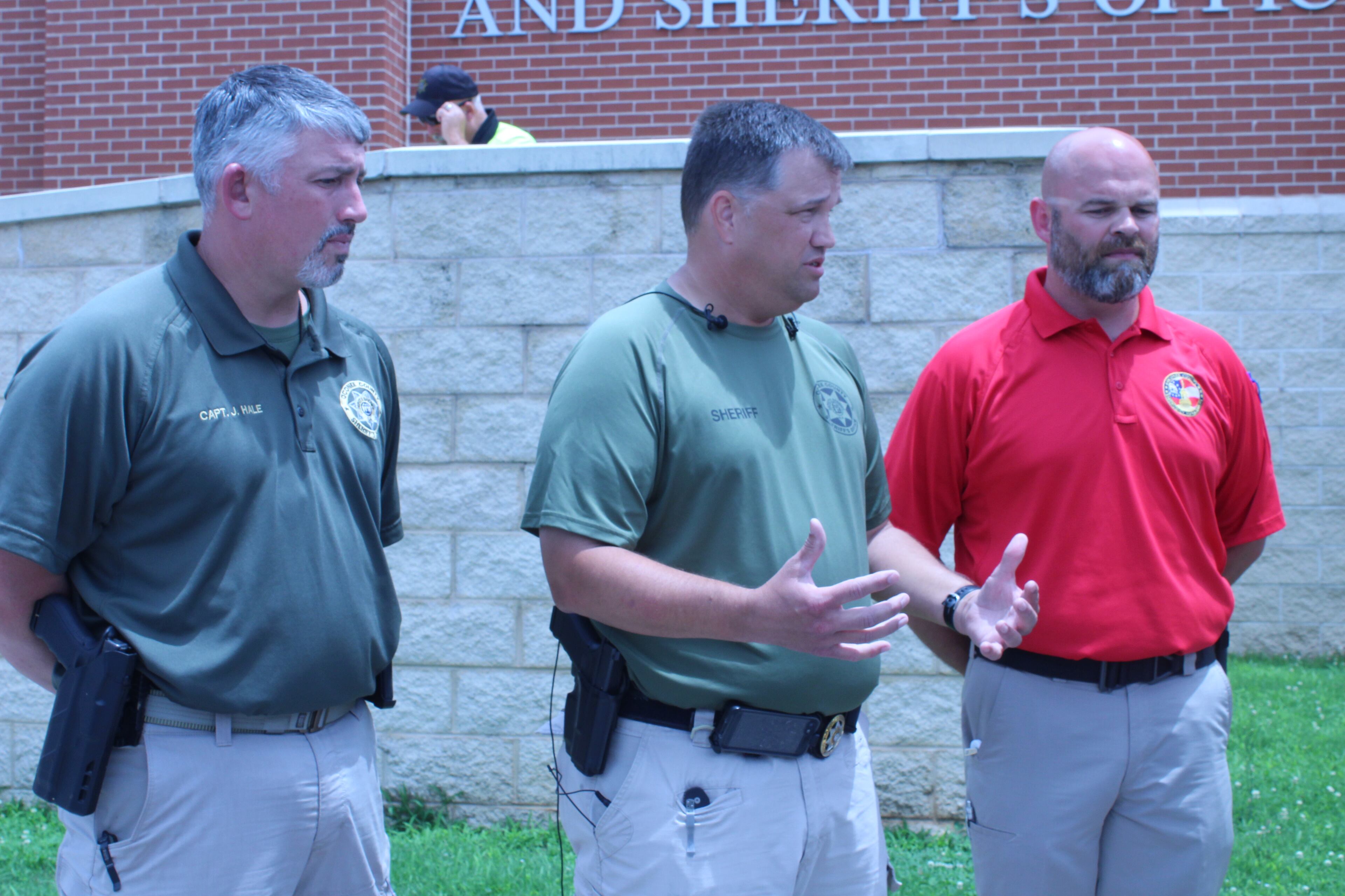 The bodies of Bryant Wade and Cameron Smith were found shortly after 11 a.m., Oconee County sheriff’s chief deputy Lee Reems (center) said during an afternoon news conference. He was joined by Capt. James Hale (left) and EMA director C.J. Worden. ASIA BURNS / ABURNS@AJC.COM