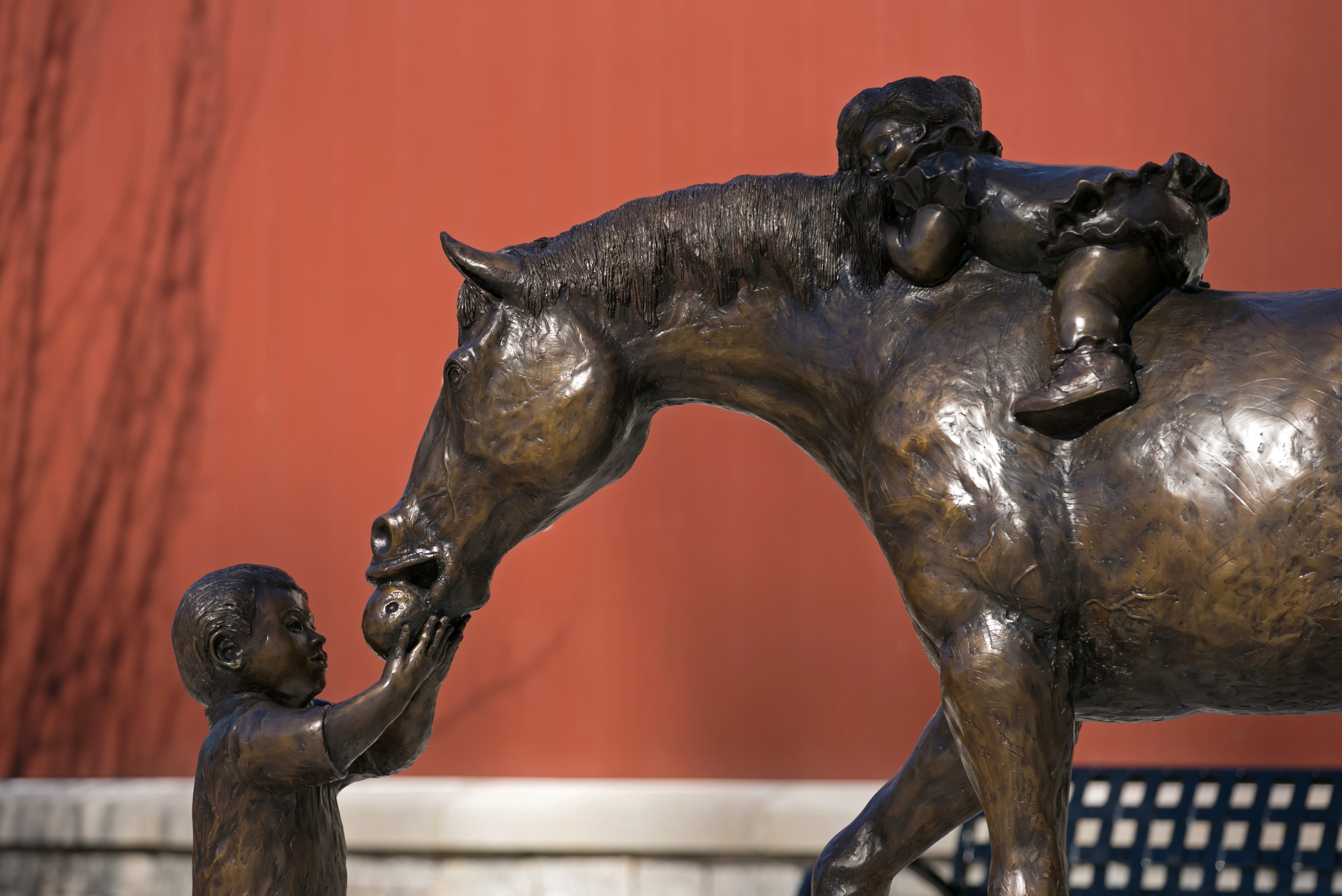 Milty, a bronze sculpture, by sculptor artist George Nock, is shown at the Milton Library Thursday, February 4, 2016, in Milton, Ga. Nock, drew his inspiration for this piece from the area's rural roots, kids and the pursuit of knowledge. PHOTO / JASON GETZ