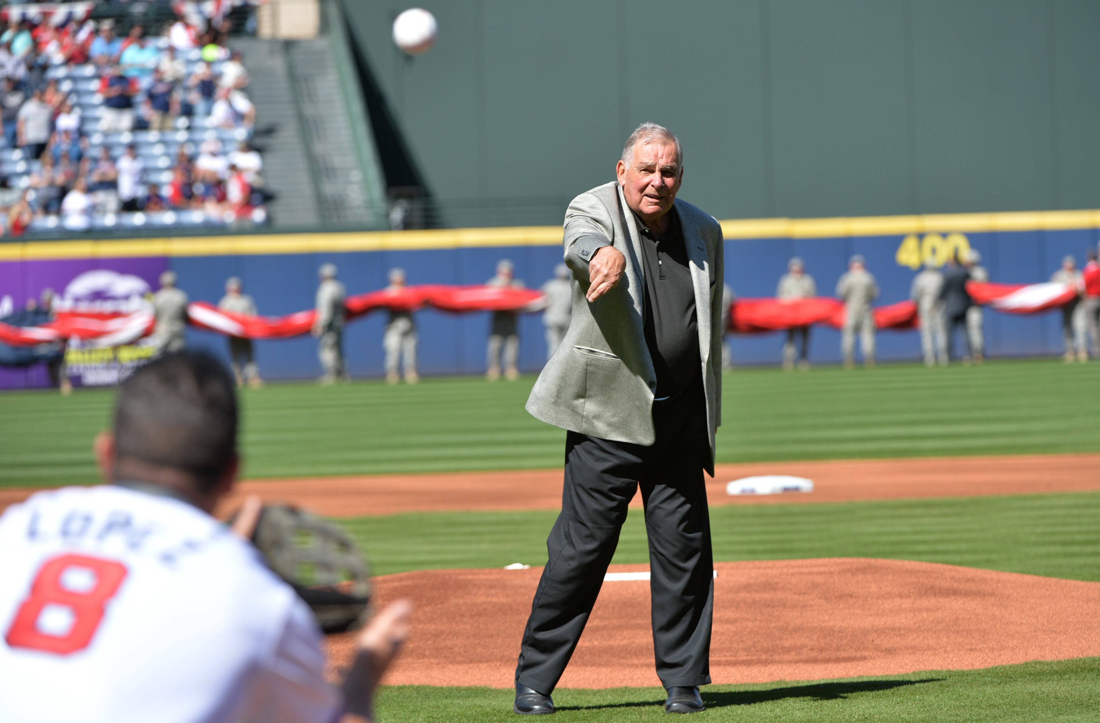 Cox threw out the ceremonial first pitch to Lopez .....