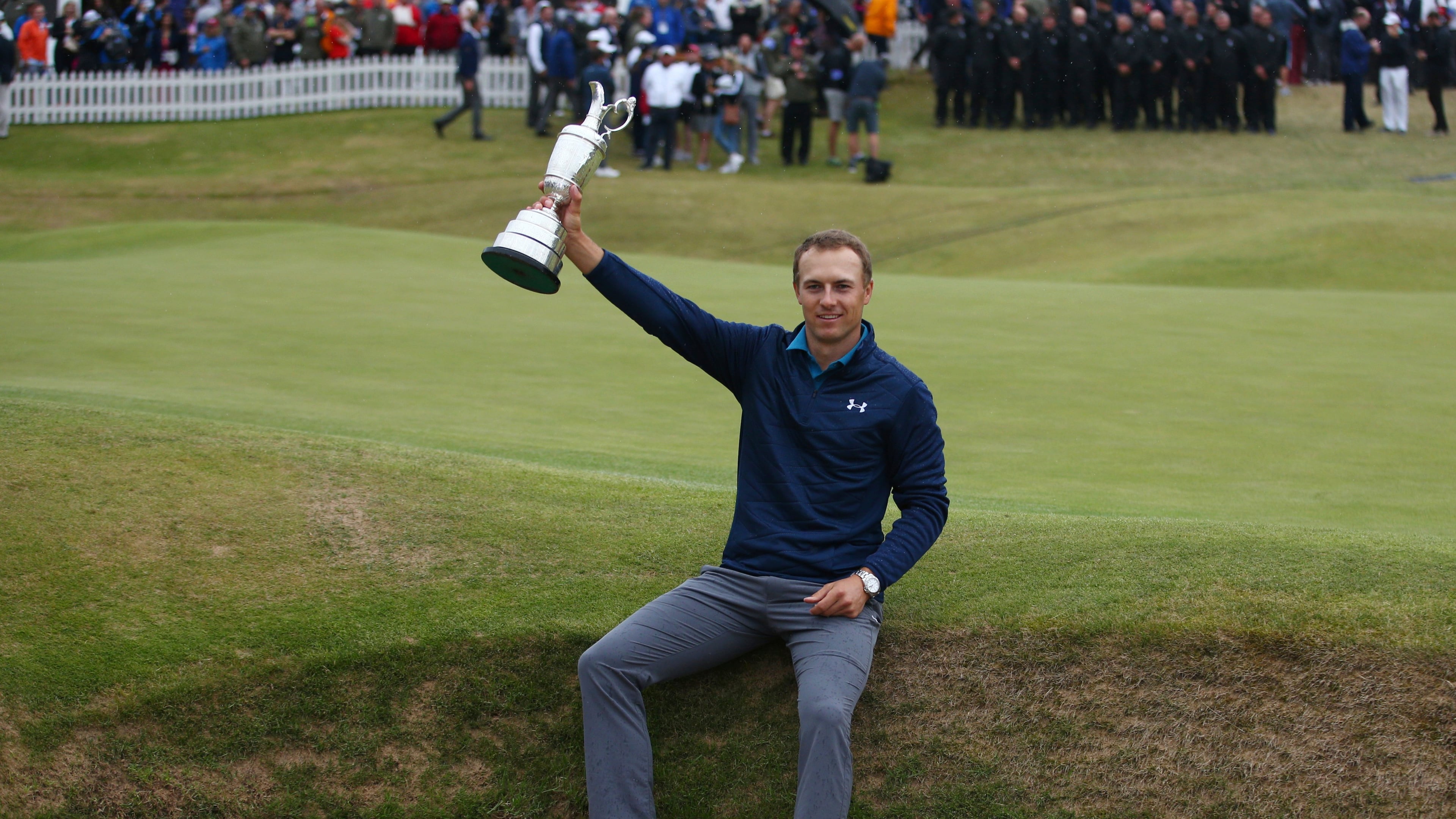FILE - Jordan Spieth of the United States holds the trophy after winning the British Open Golf Championships at Royal Birkdale, Southport, England, July 23, 2017. (AP Photo/Dave Thompson, File)