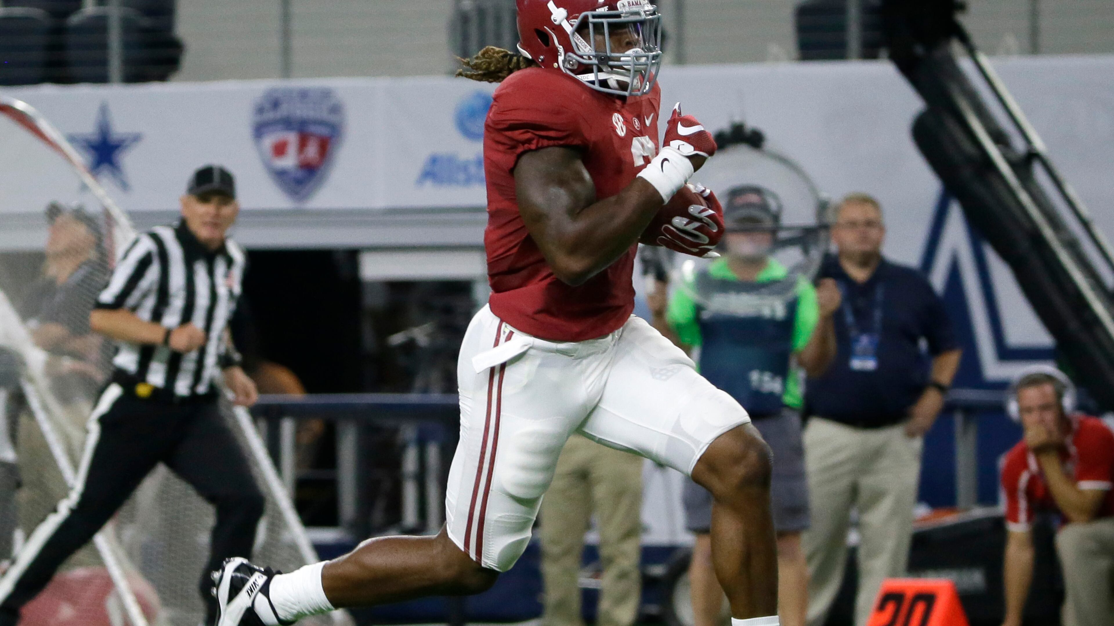 Alabama running back Derrick Henry rushes for a touchdown during the first half of an NCAA college football game against Wisconsin, Saturday, Sept. 5, 2015, in Arlington, Texas. (AP Photo/LM Otero)