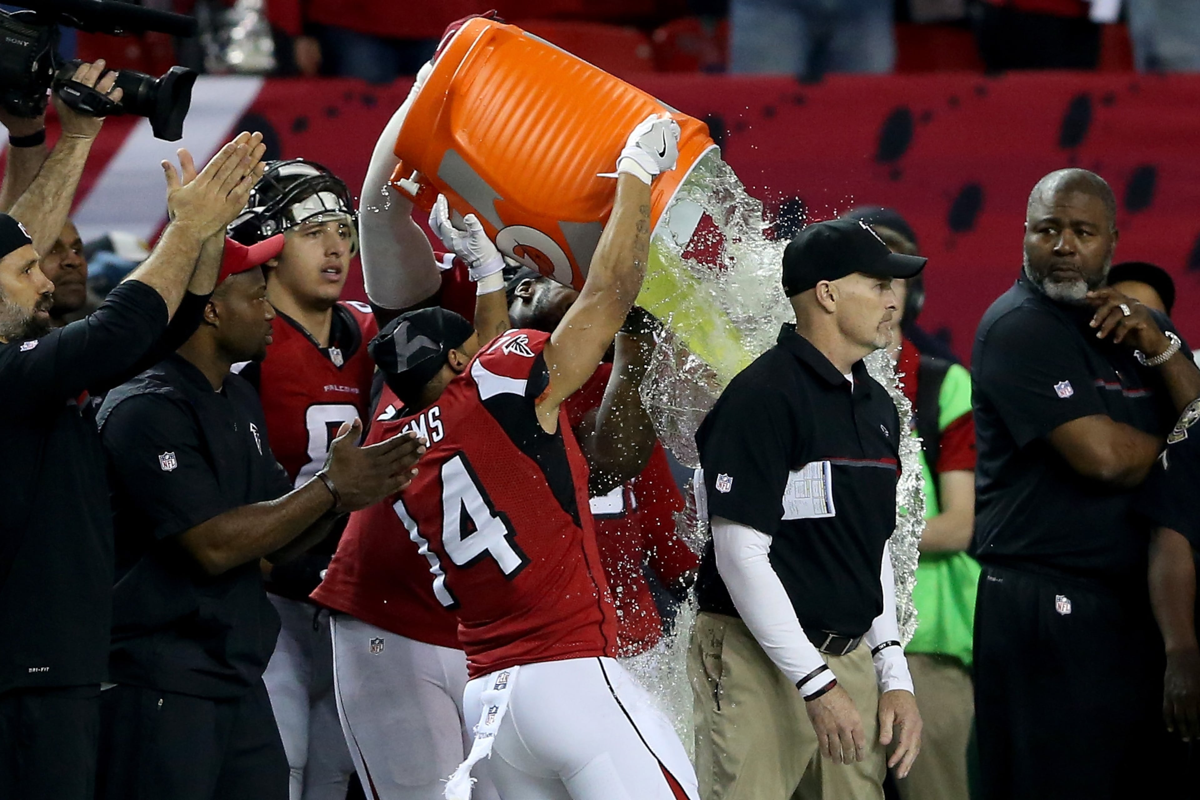 ATLANTA, GA - JANUARY 22: Head coach Dan Quinn of the Atlanta Falcons has gatorade dumped on him by his team late in the game against the Green Bay Packers in the NFC Championship Game at the Georgia Dome on January 22, 2017 in Atlanta, Georgia. (Photo by Streeter Lecka/Getty Images)